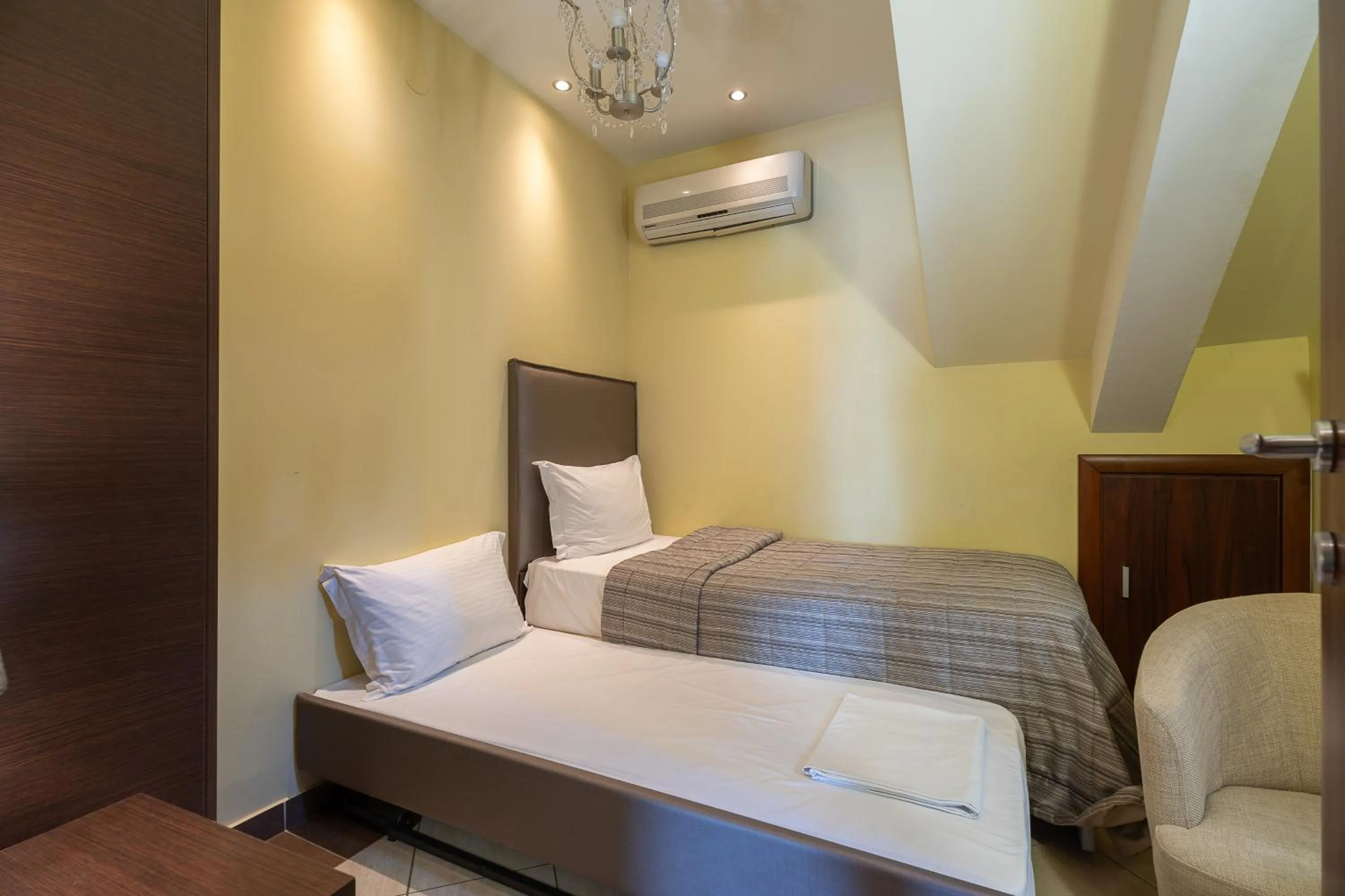 Bed in Meliton Inn Hotel & Suites by the beach