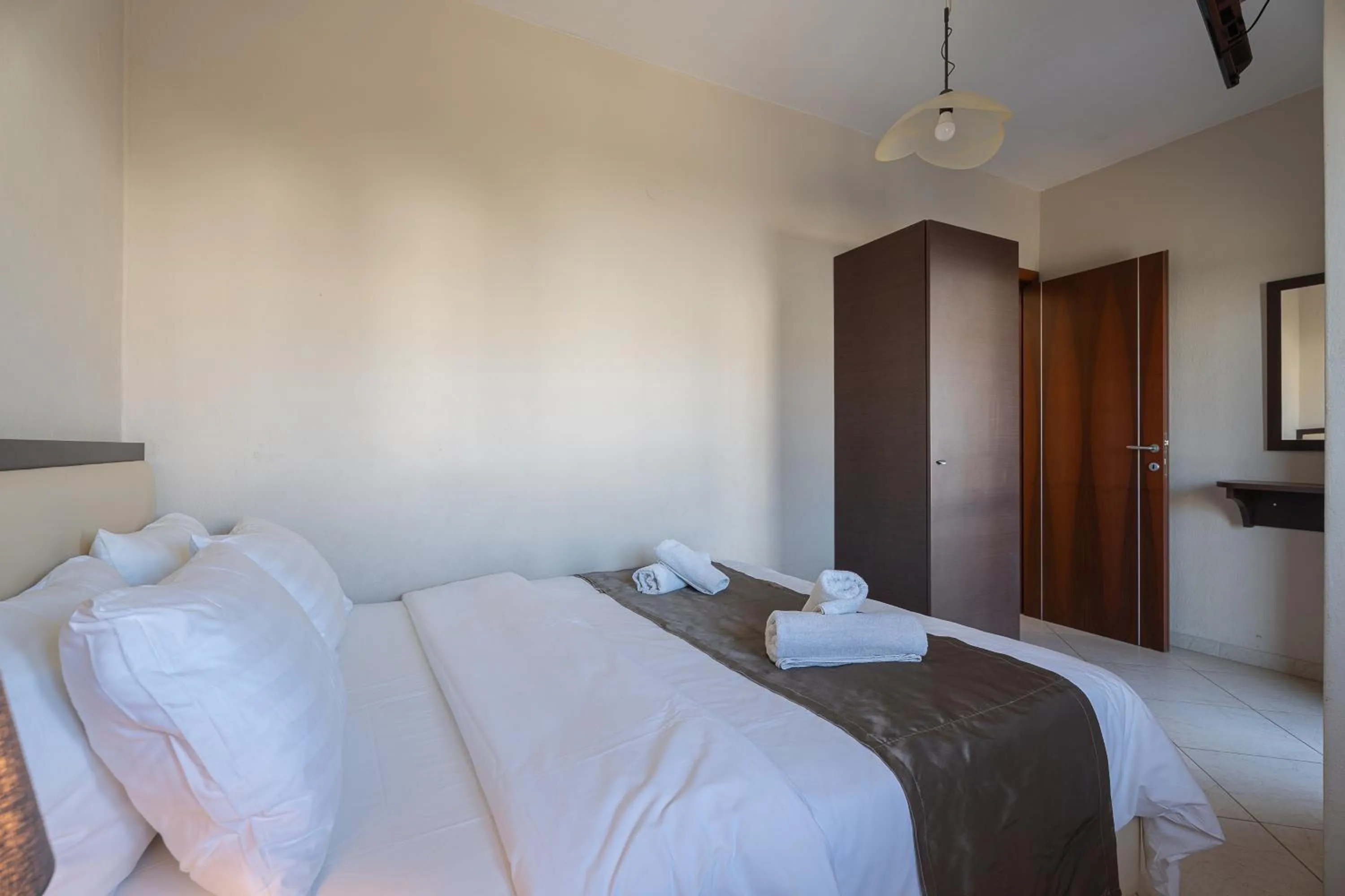 Bed in Meliton Inn Hotel & Suites by the beach