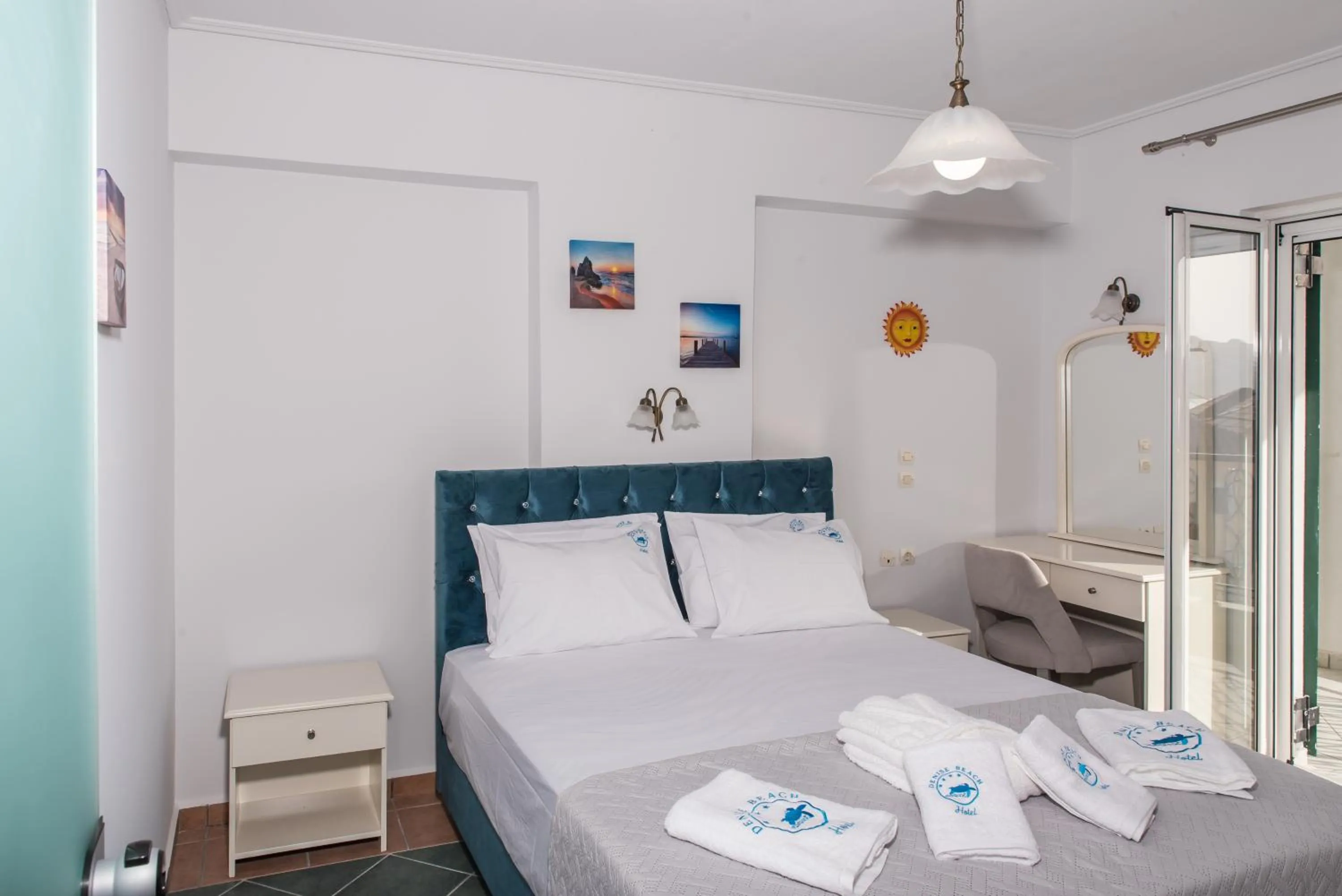 Bed in Denise Beach Hotel