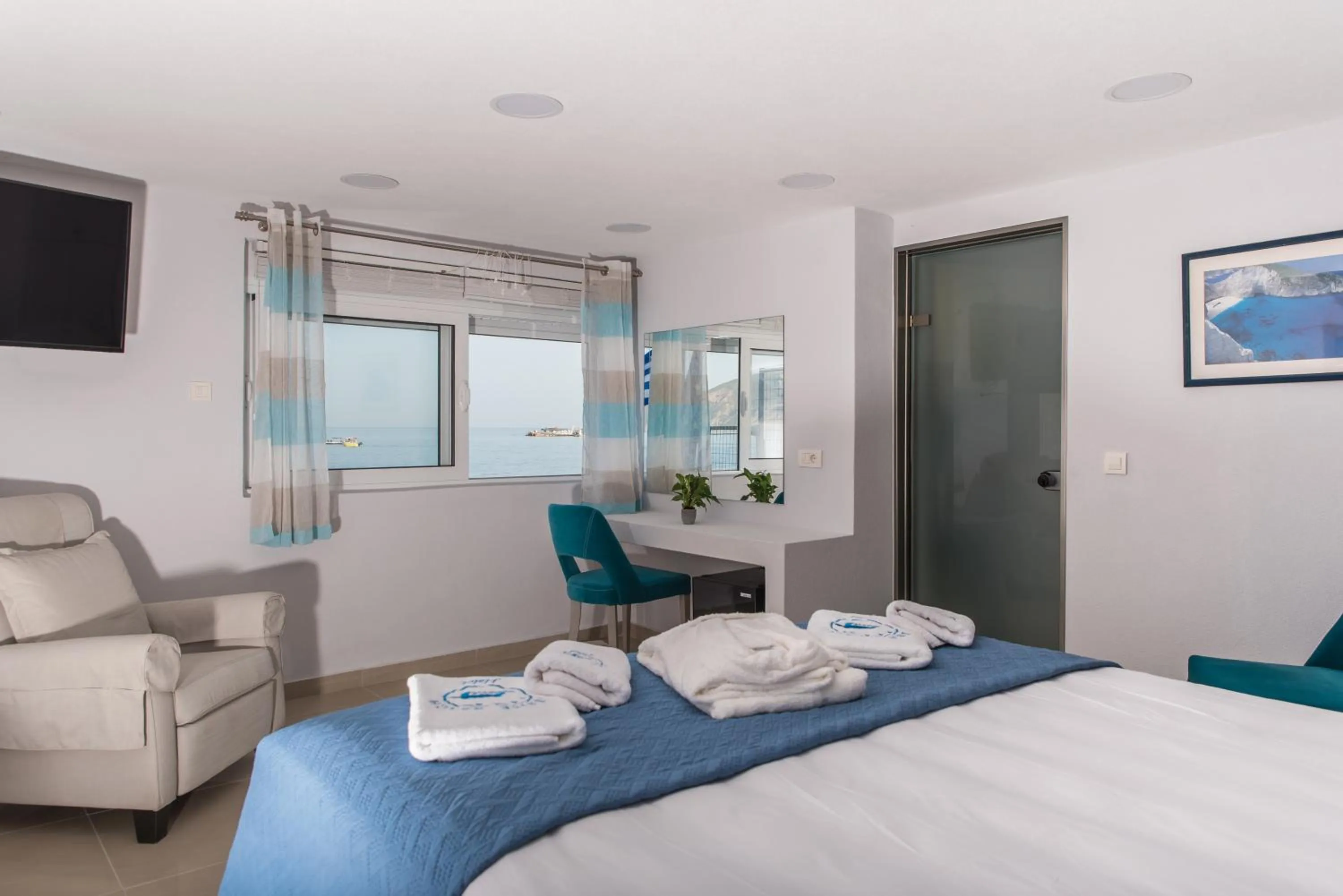 Bed in Denise Beach Hotel