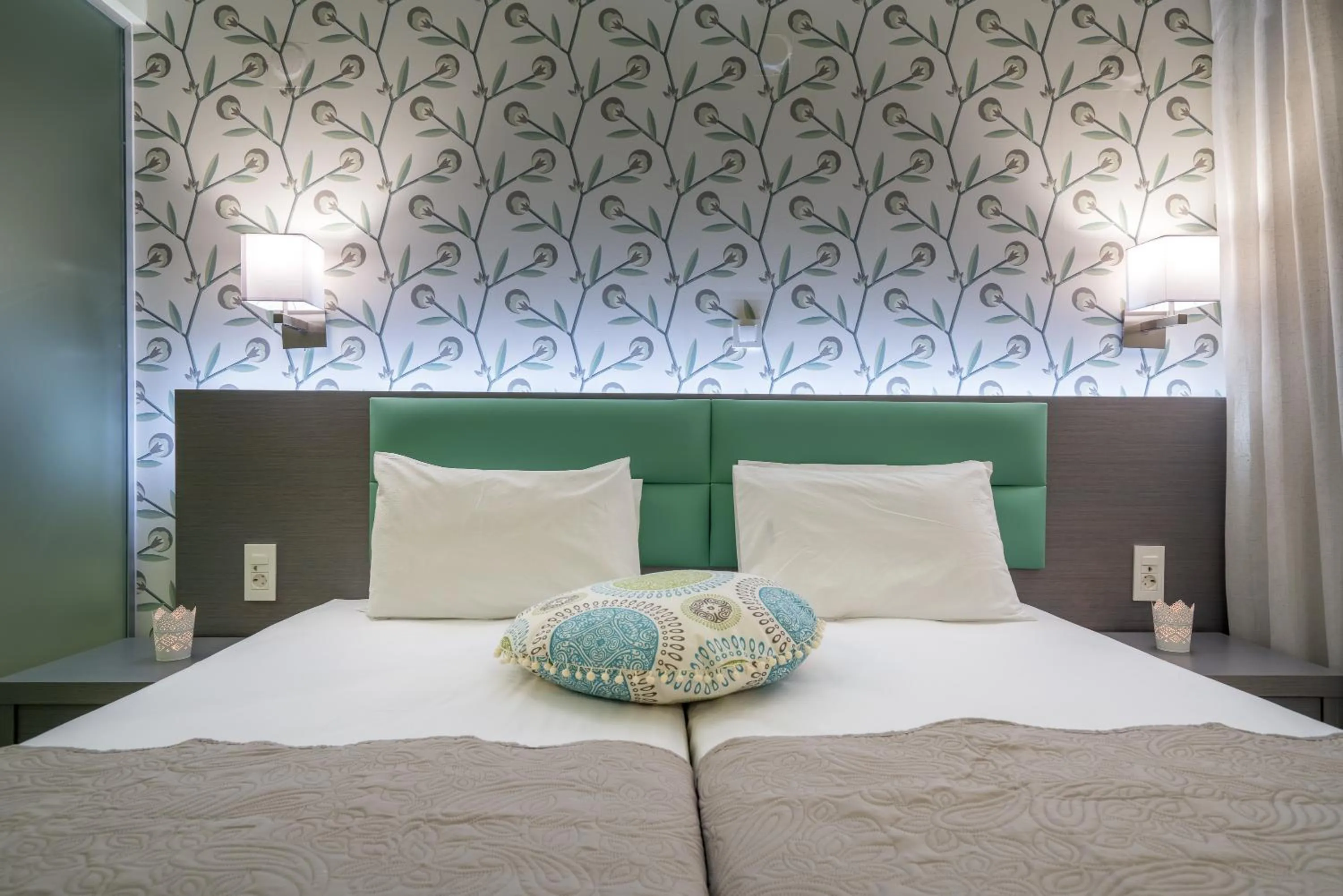 Bed in Denise Beach Hotel