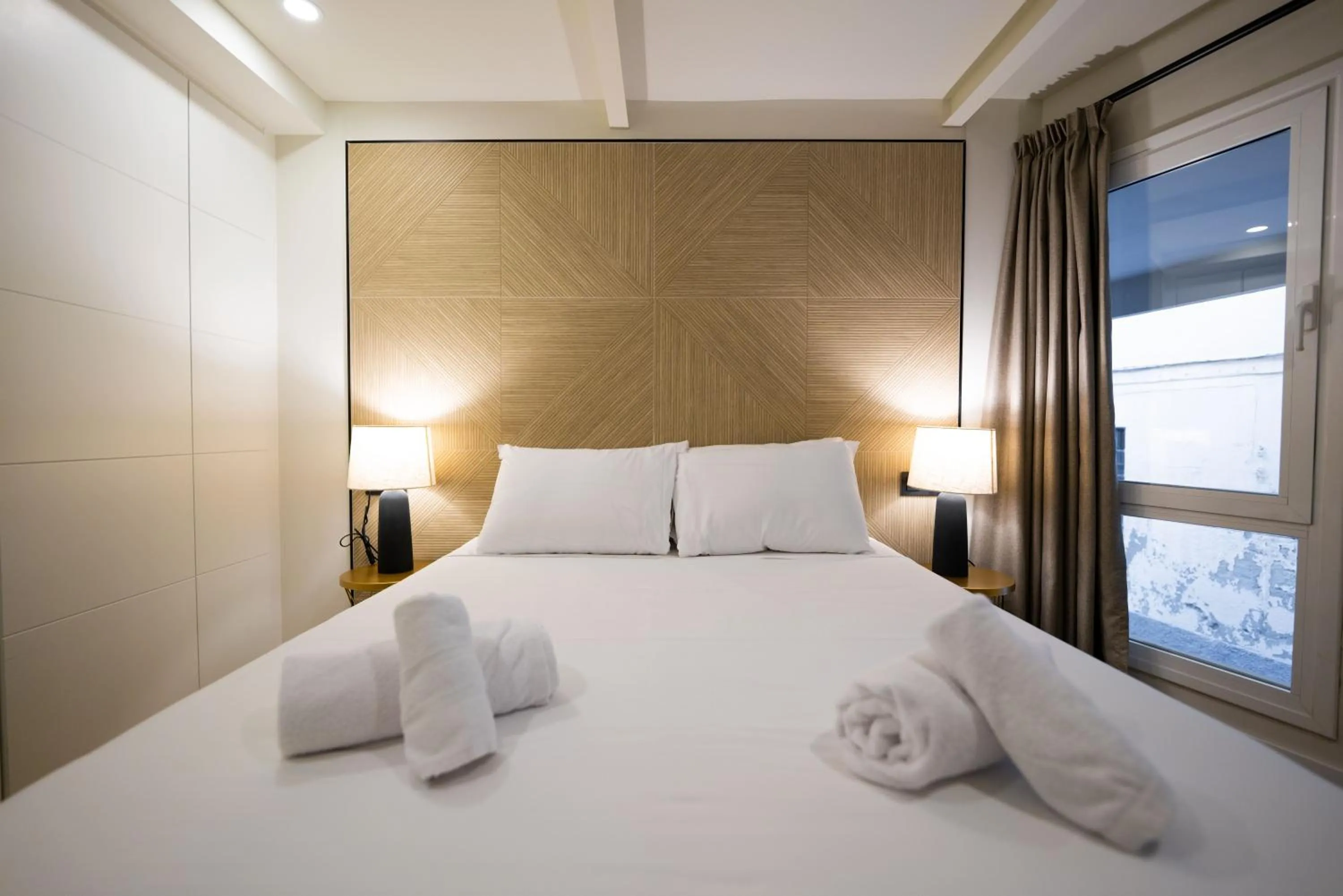 Bedroom, Bed in Apartamentos Málaga Premium - Calle San Telmo