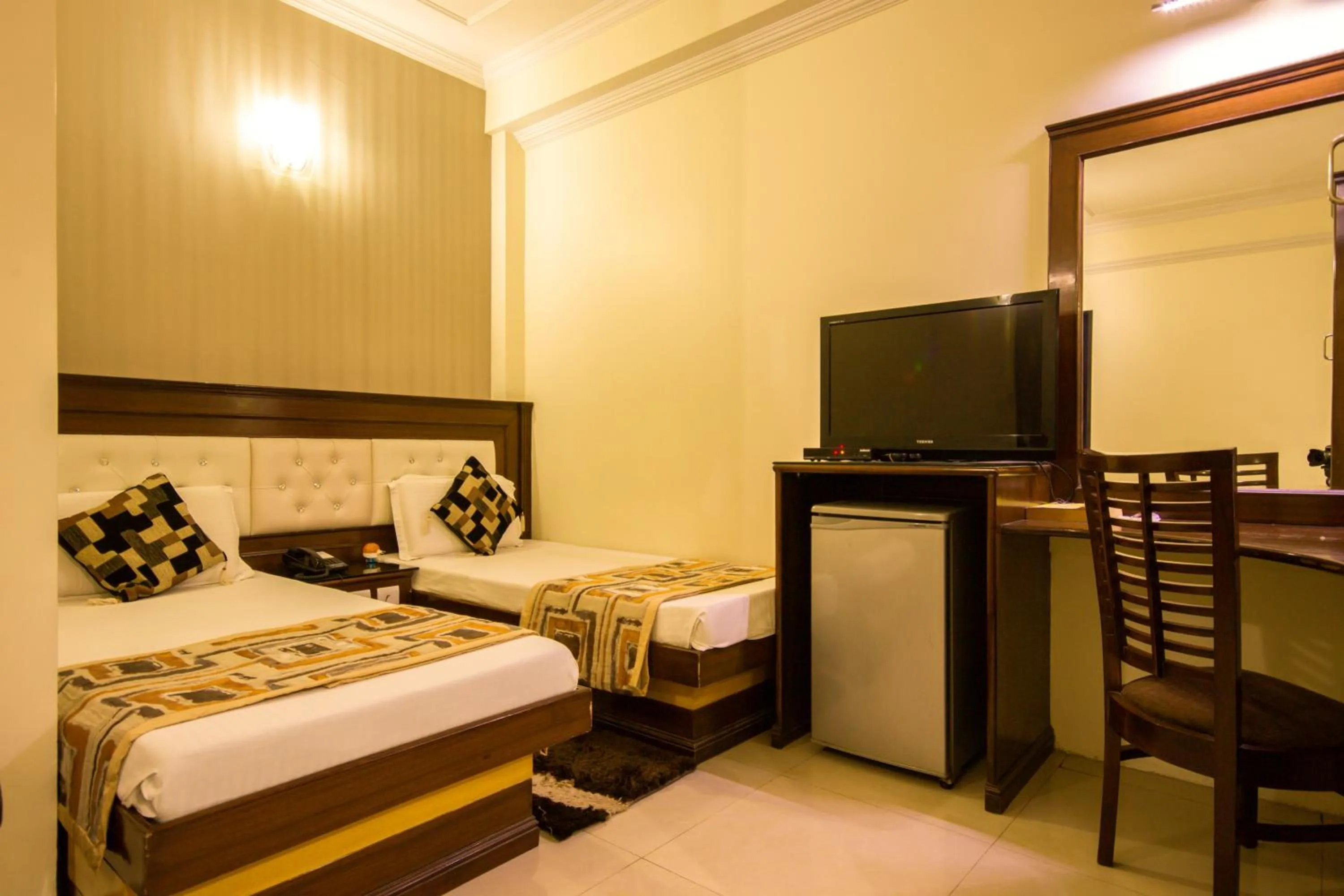 Bed in Hotel Grand Park Inn