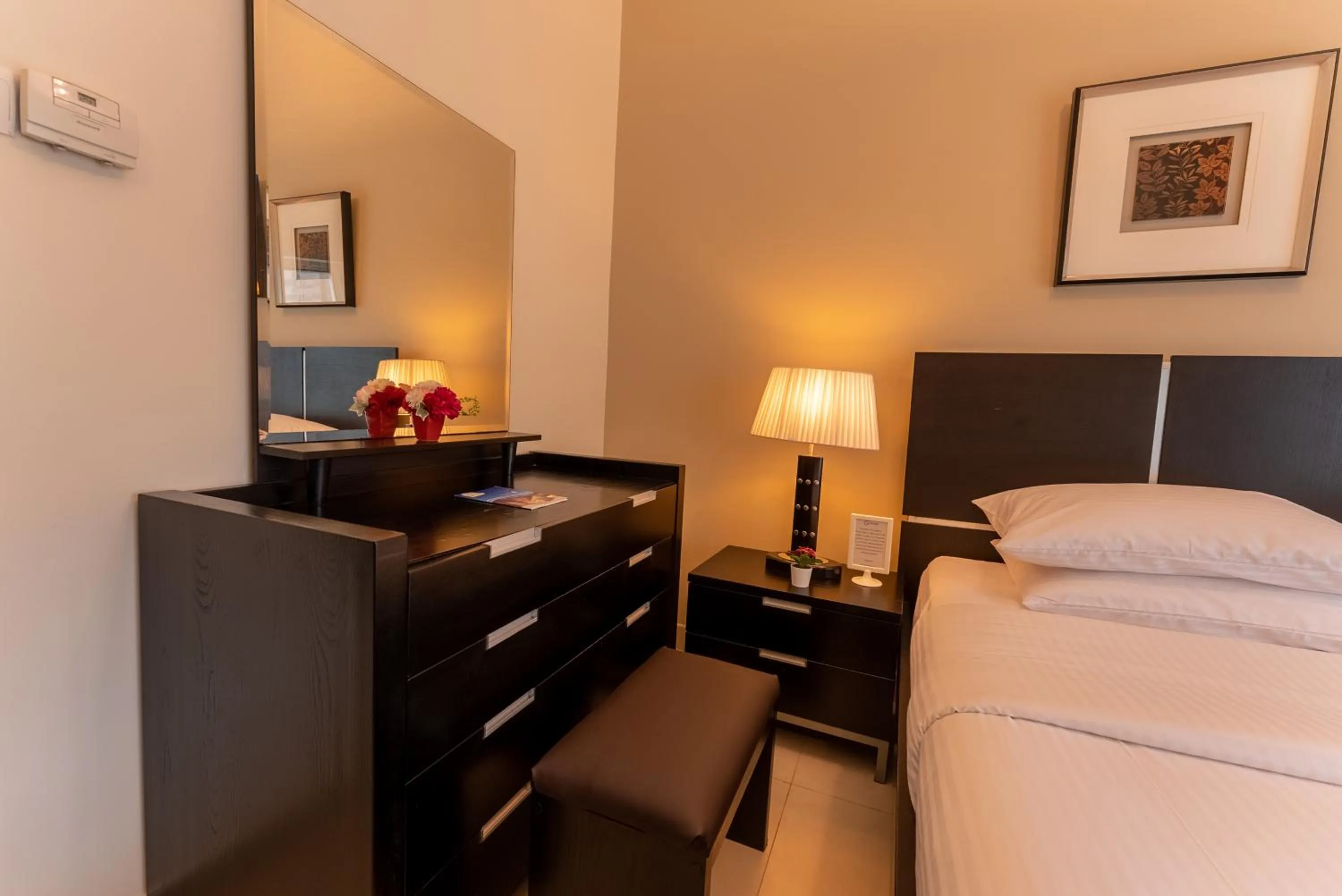 Decorative detail, Bed in Gulf Oasis Hotel Apartments Fz LLC