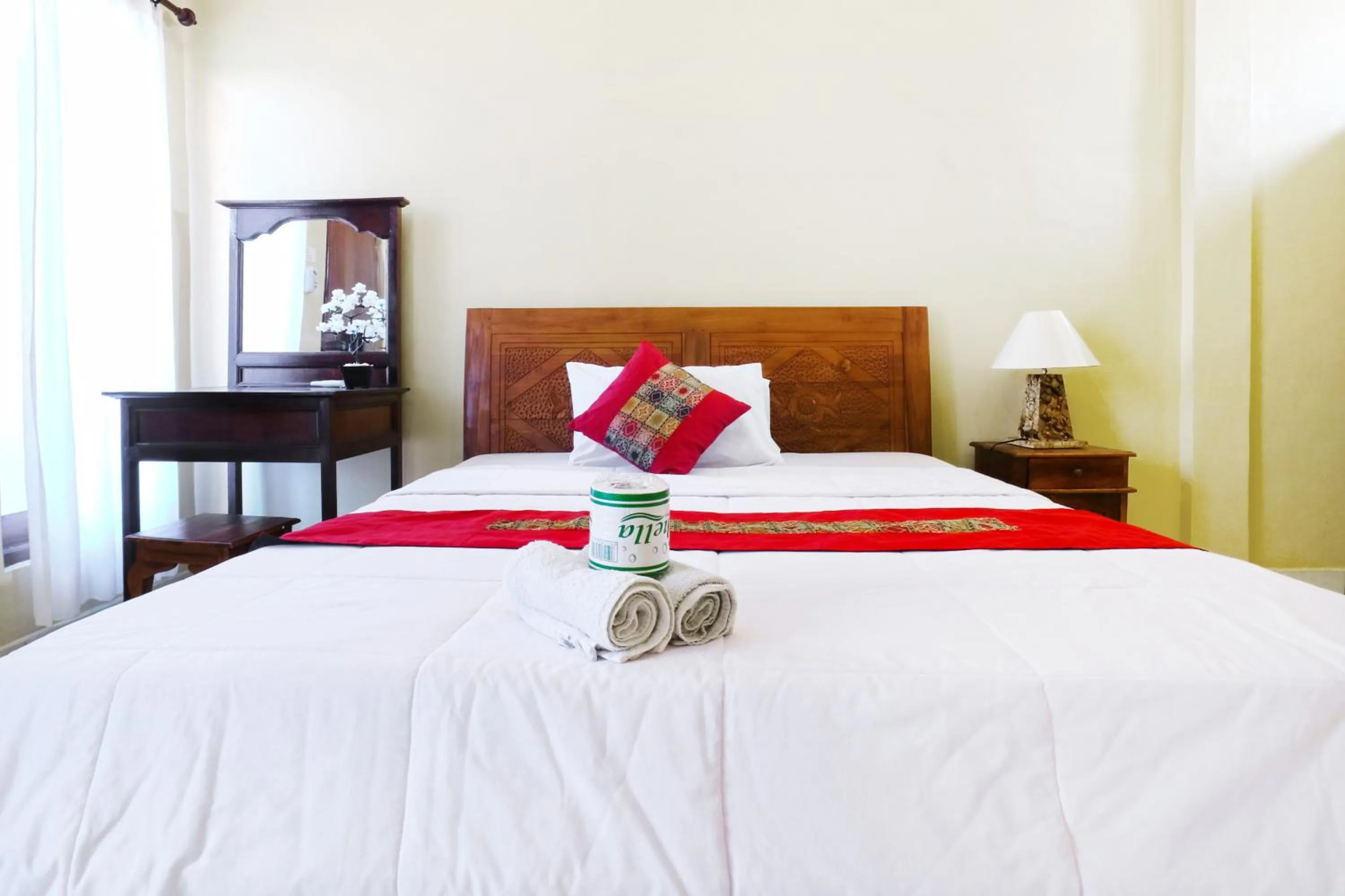 Bed in Jungut Guest House Ubud