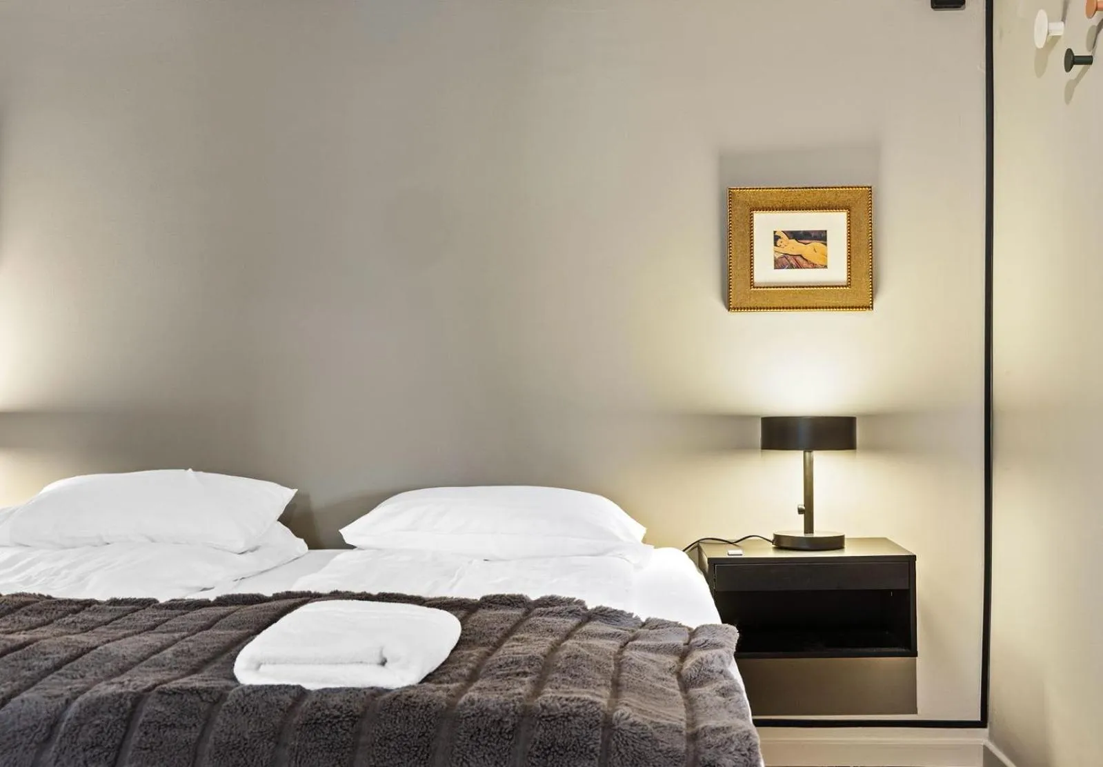 Bed in Astro Apartments