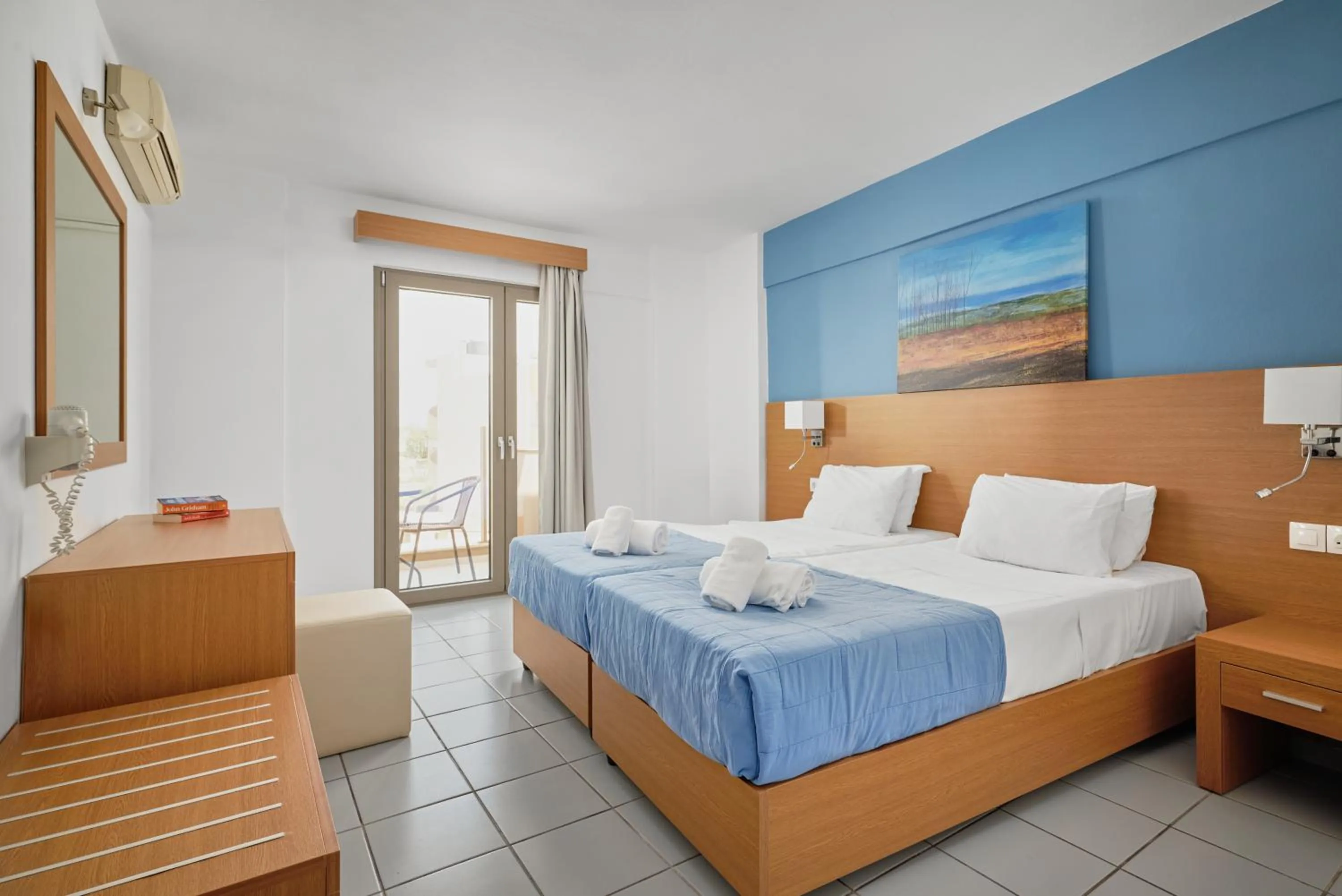 Bed in Acropolis Apartments