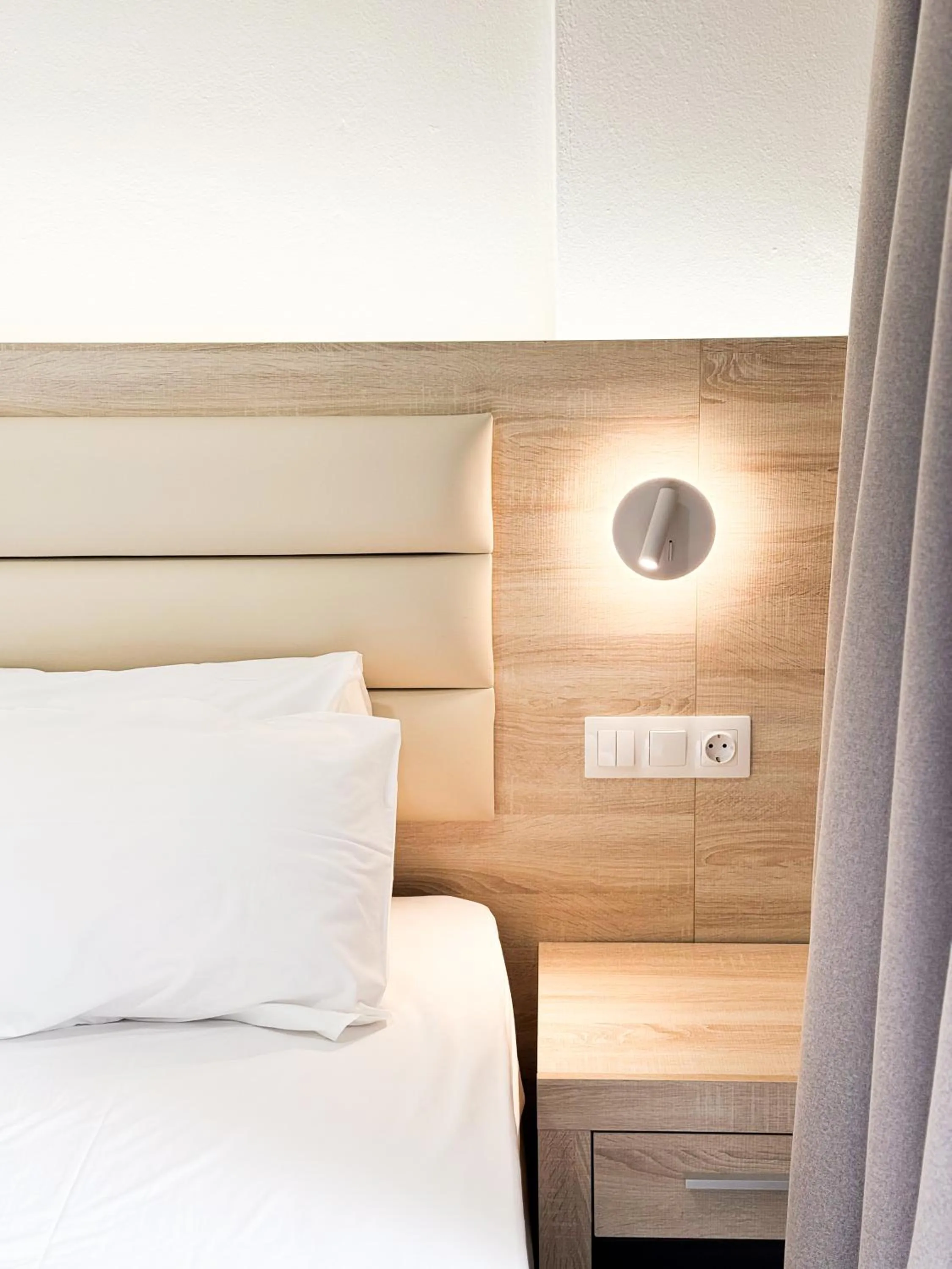 Bed in Acropolis Apartments