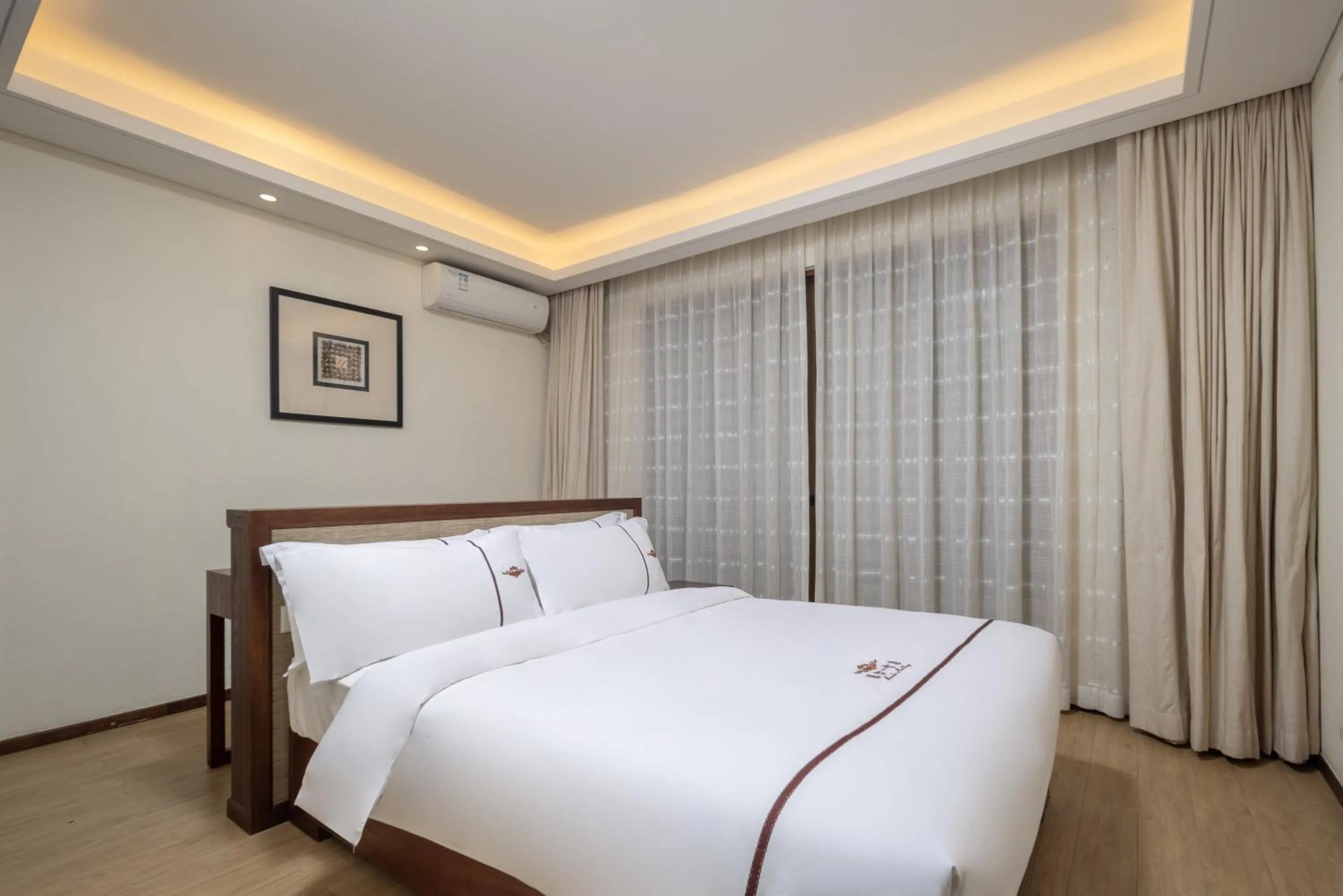 Bed in Iccssi Villa Haitang Bay Sanya