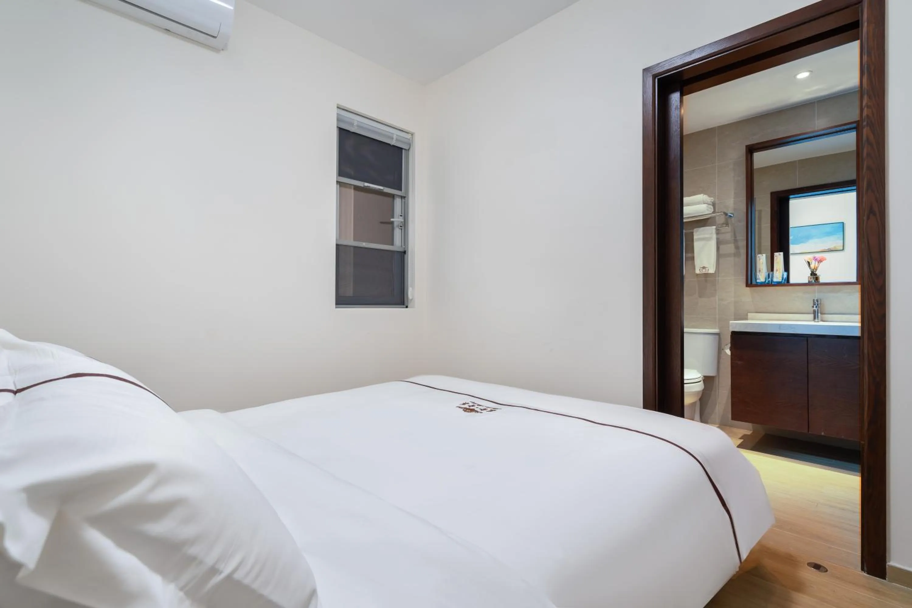 Bed in Iccssi Villa Haitang Bay Sanya