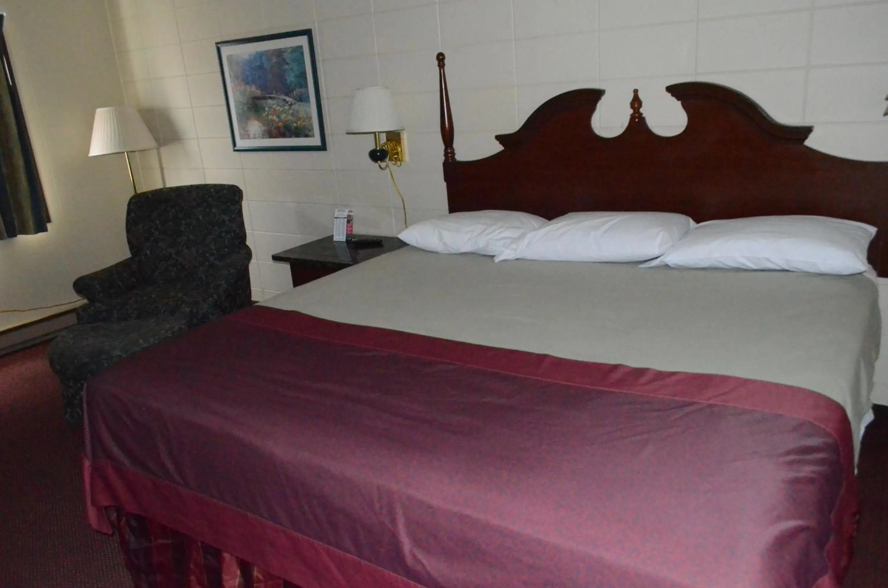 Bed in Grand Inn Fargo