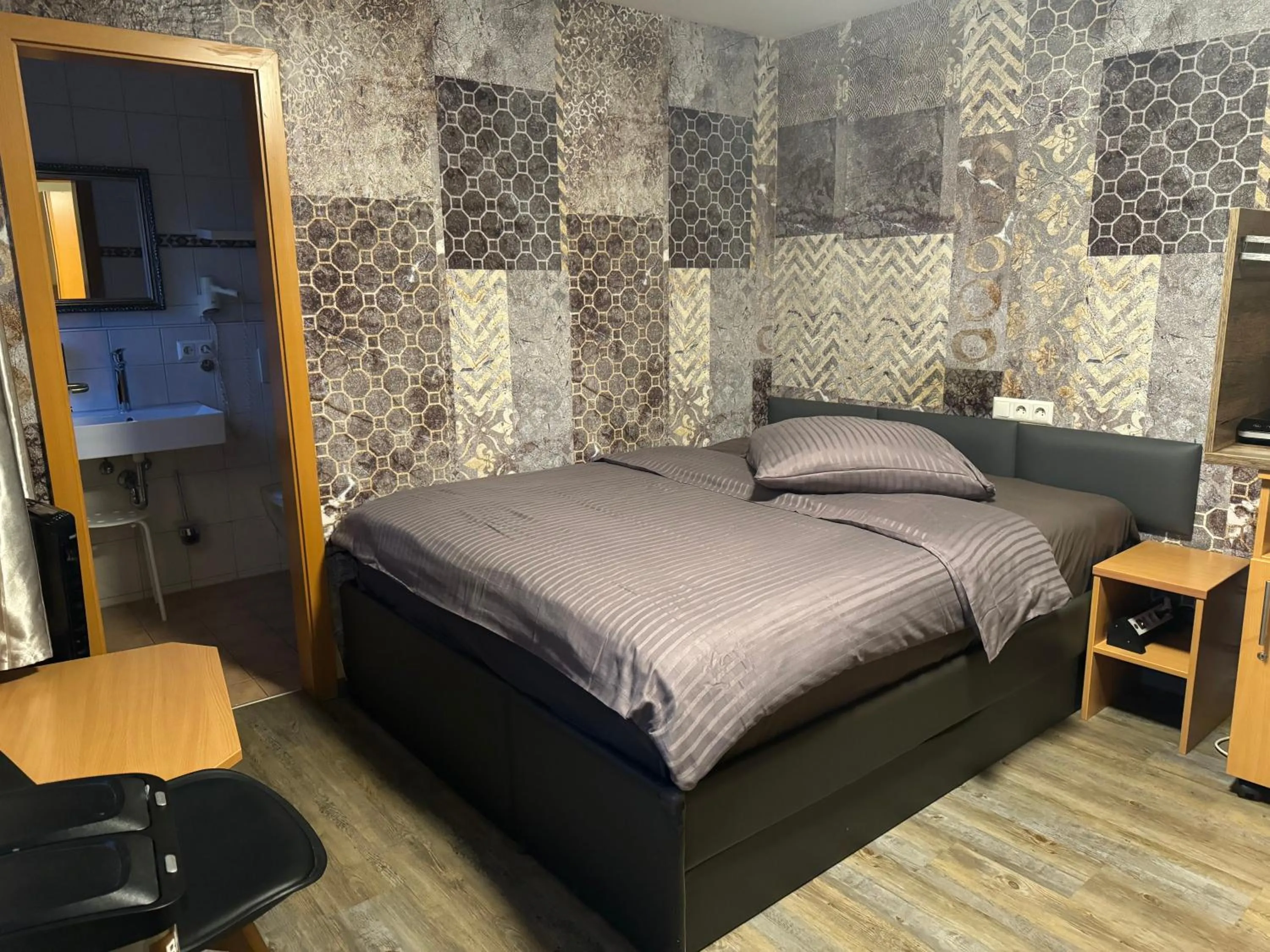 Bed in Hotel Mythos "rooms with kitchenette- apartments with kitchen"