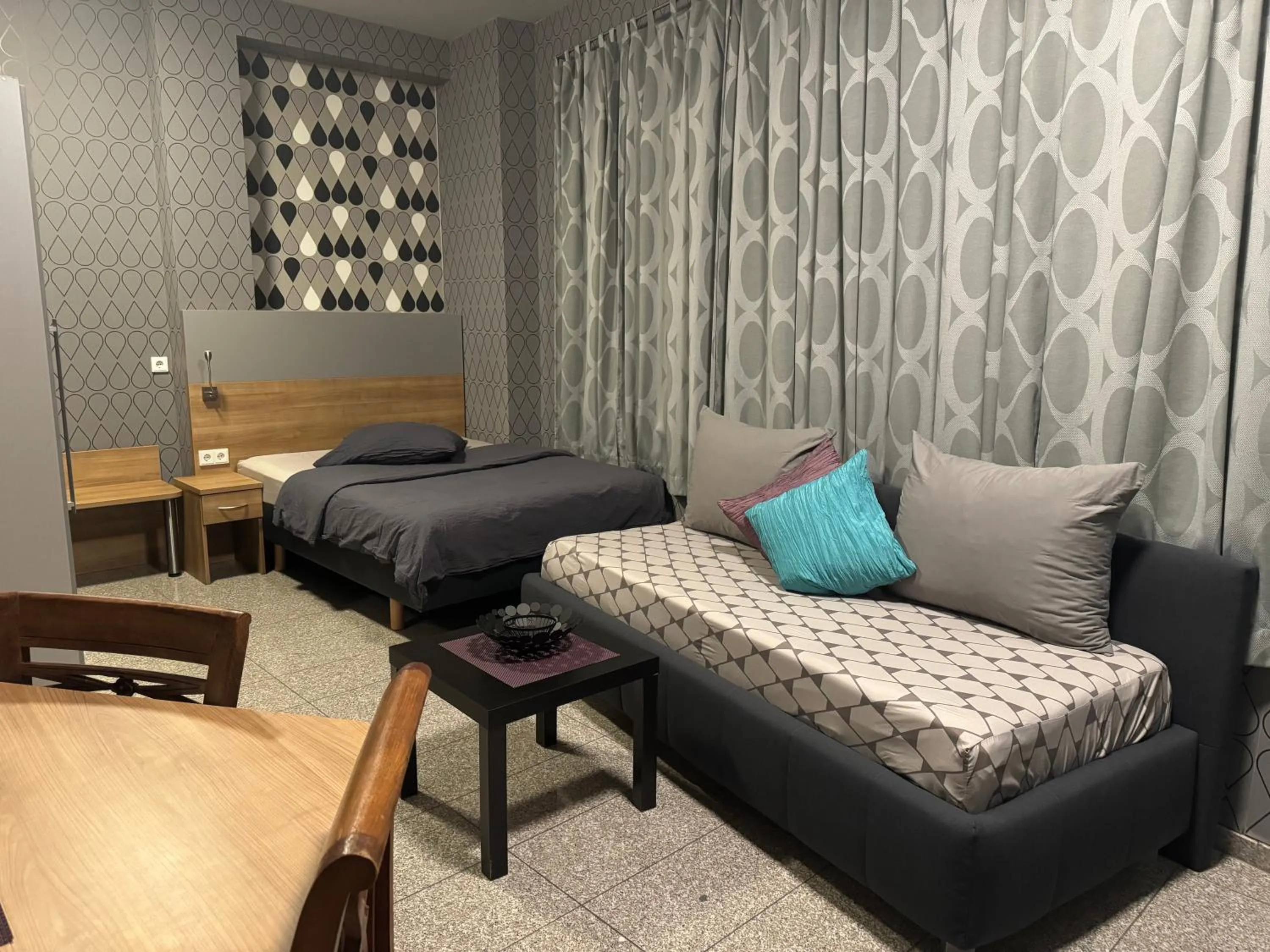 Bed in Hotel Mythos "rooms with kitchenette- apartments with kitchen"