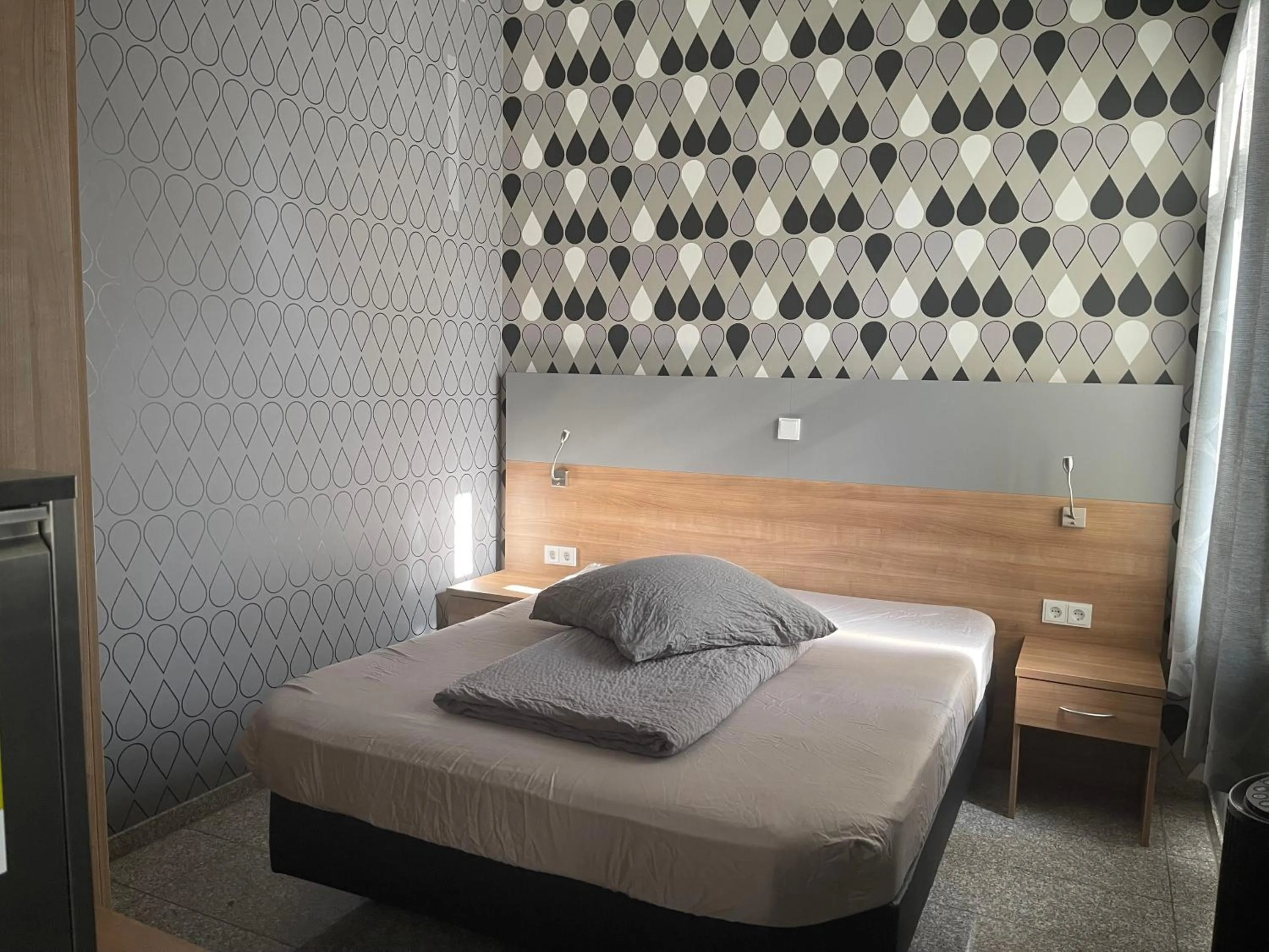 Bed in Hotel Mythos "rooms with kitchenette- apartments with kitchen"