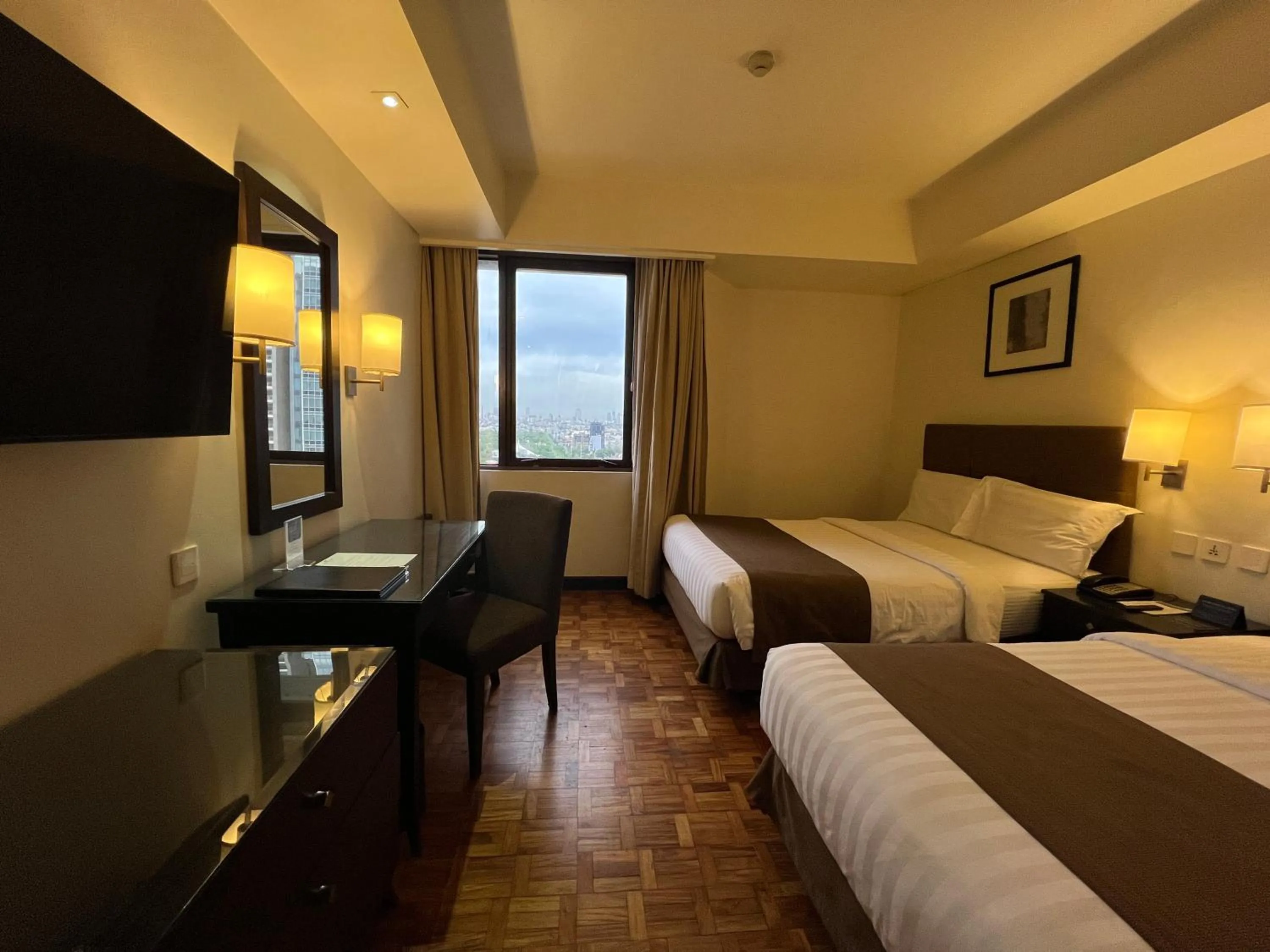 Bed in City Garden Hotel Makati