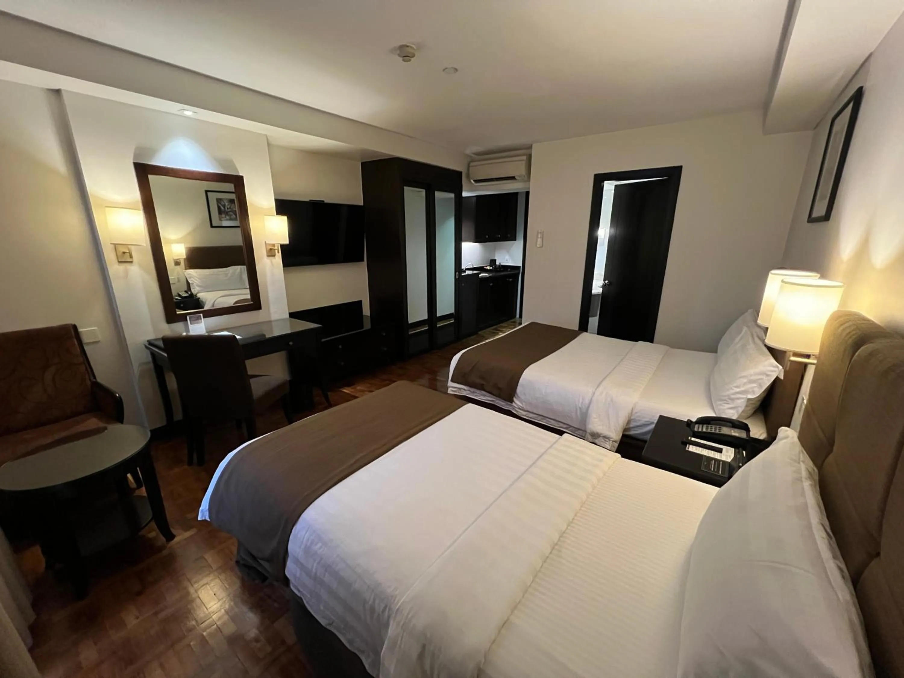 Bed in City Garden Hotel Makati