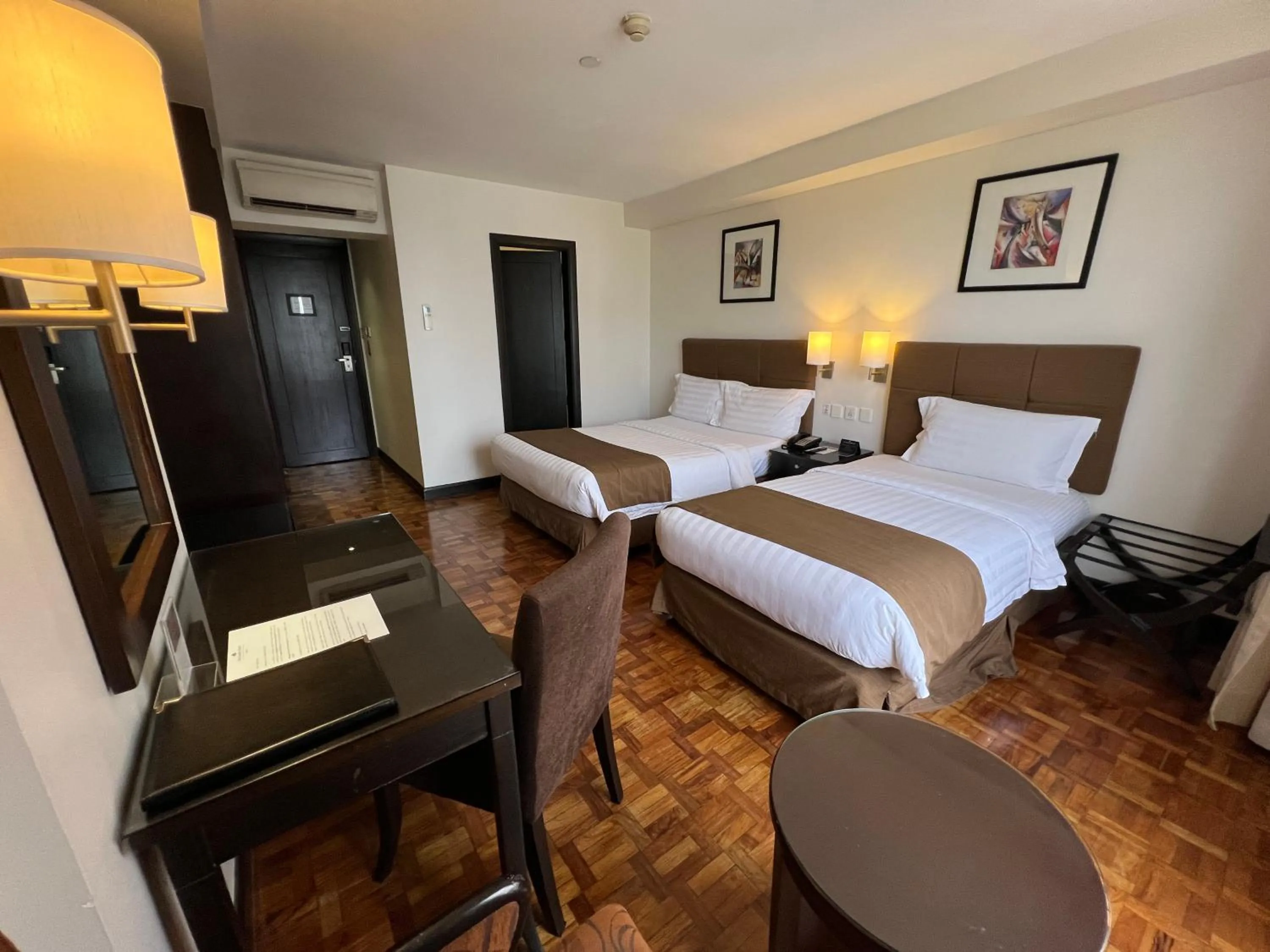 Bed in City Garden Hotel Makati