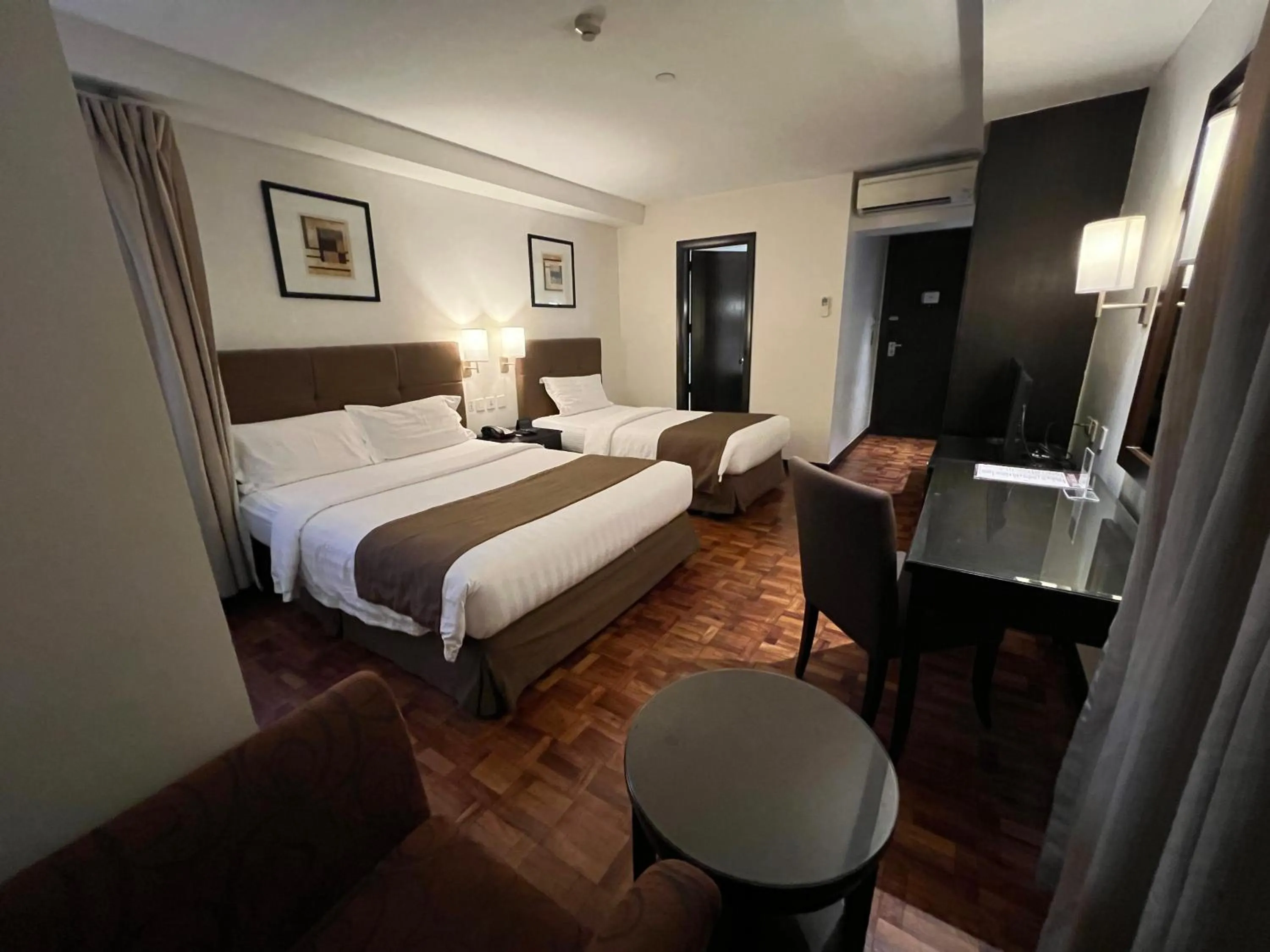 Bed in City Garden Hotel Makati