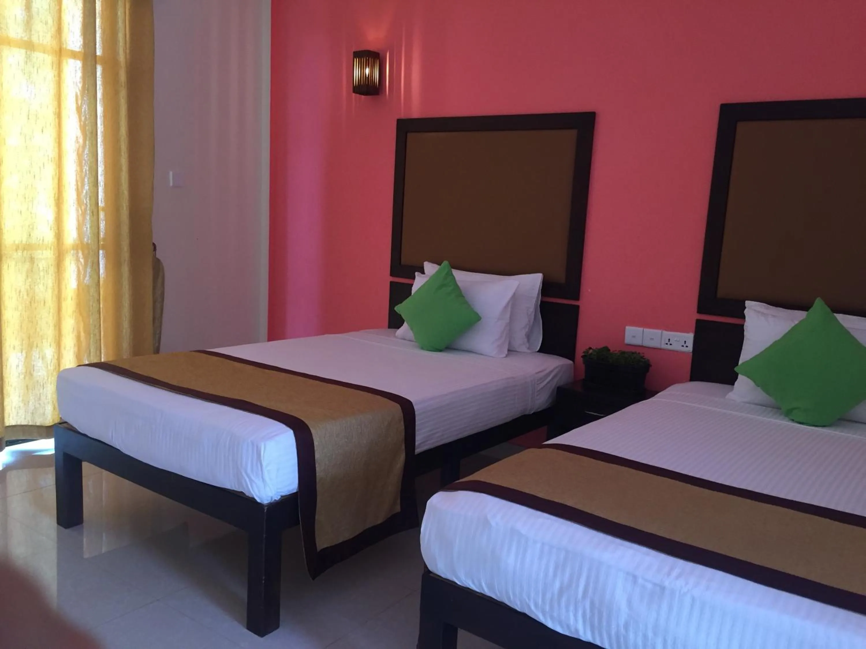 Bed in Organic Garden Resort Sigiriya