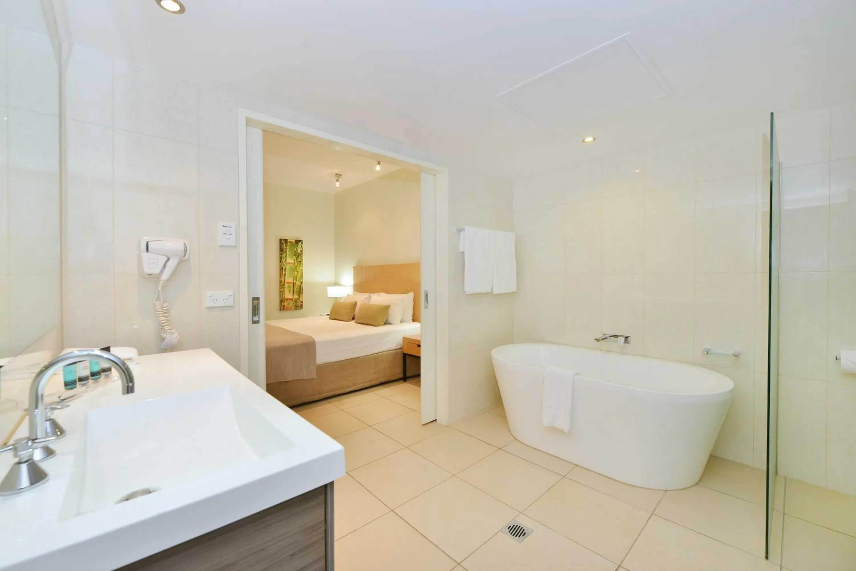 Bathroom, Bed in Club Tropical Resort - Official Onsite Reception & Check In