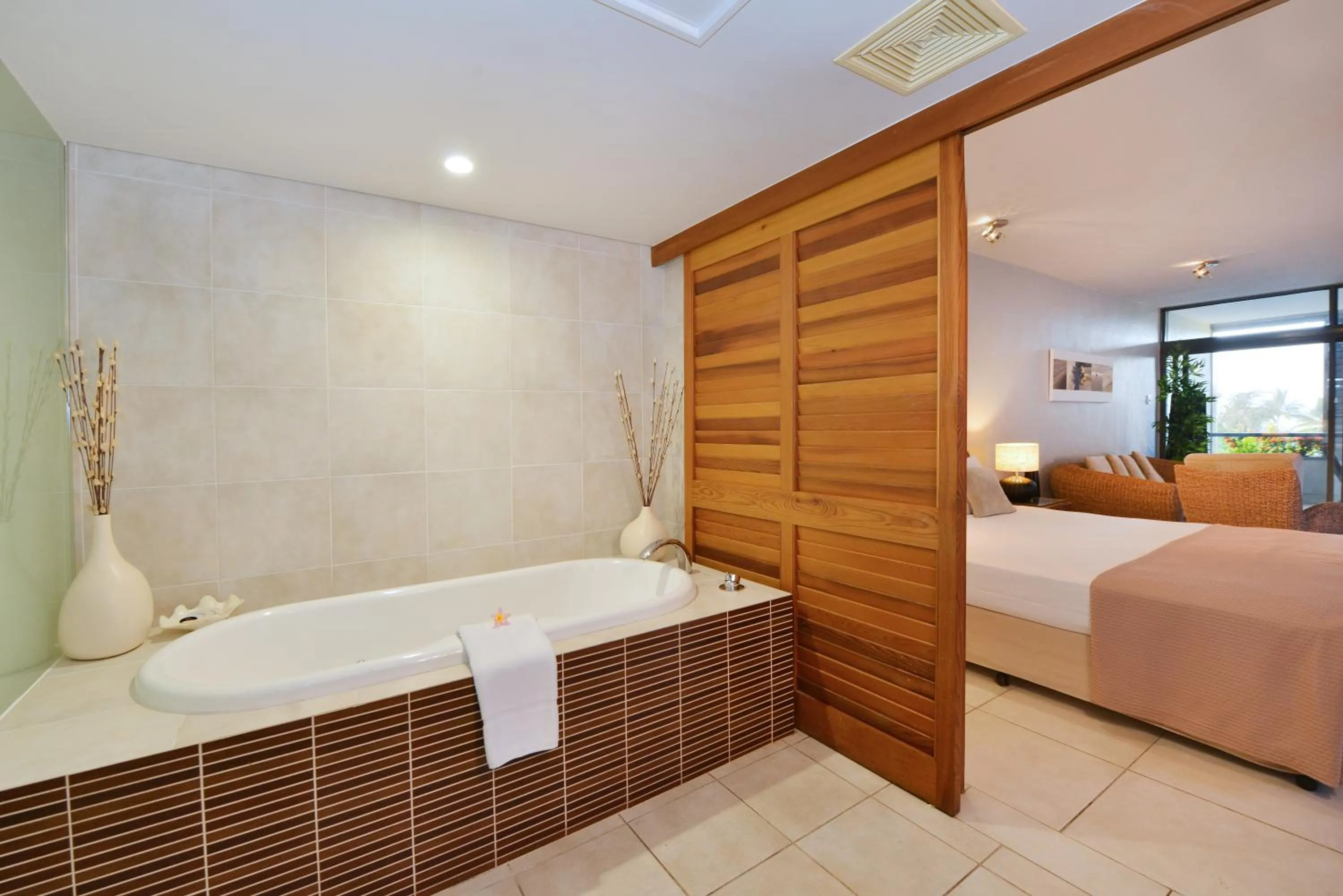 Bathroom, Bed in Club Tropical Resort - Official Onsite Reception & Check In
