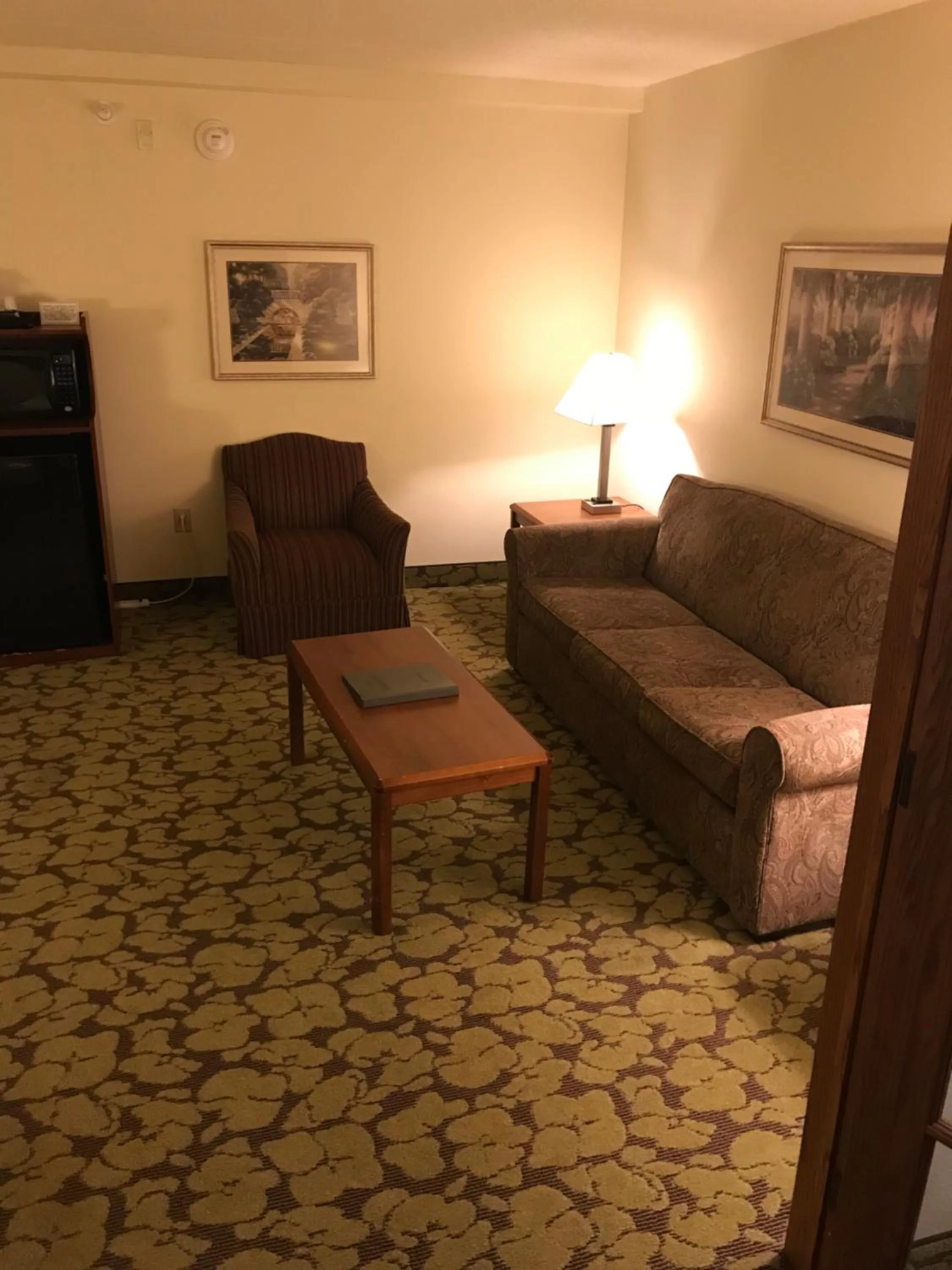 Living room in AmericInn by Wyndham Appleton North Little Chute