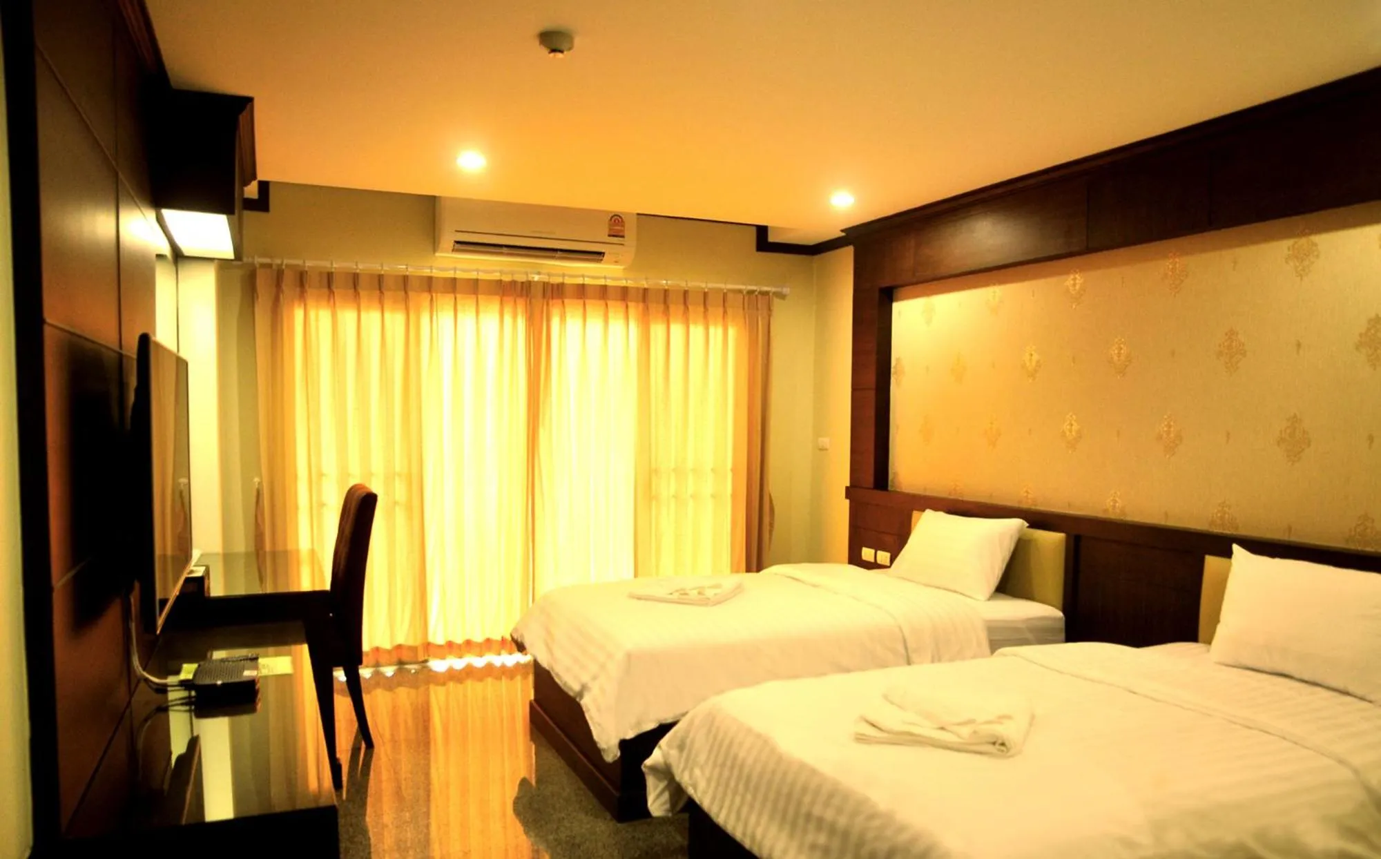 Bed in Green Hill Hotel Phayao