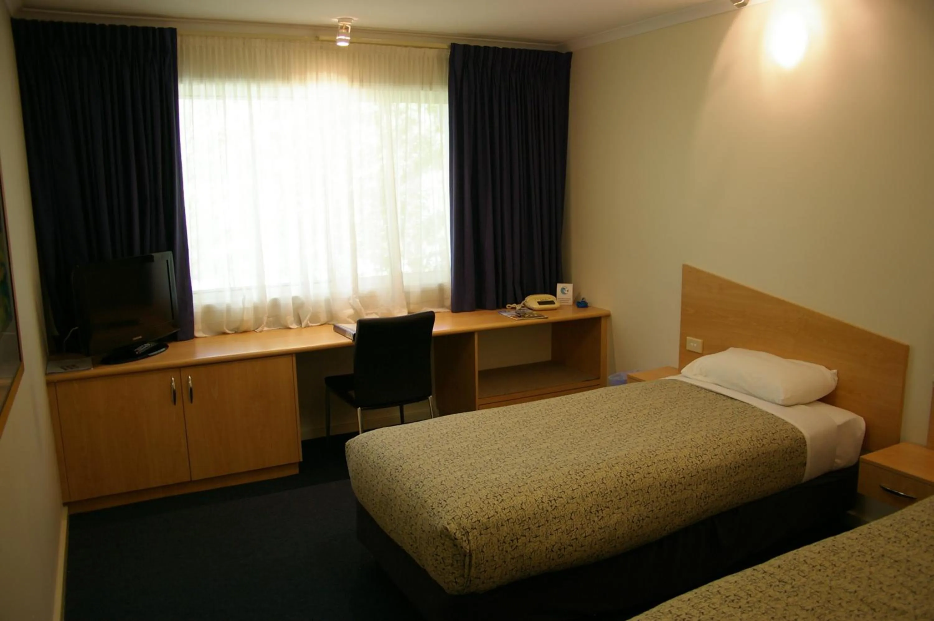 Bed in Ramada Encore by Wyndham Belconnen Canberra
