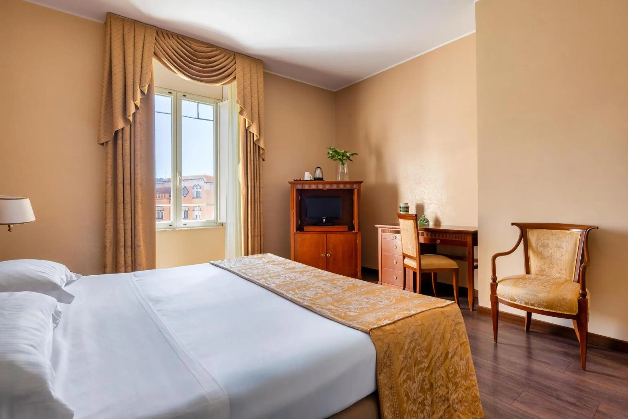 Bed in Excelsior Palace Hotel