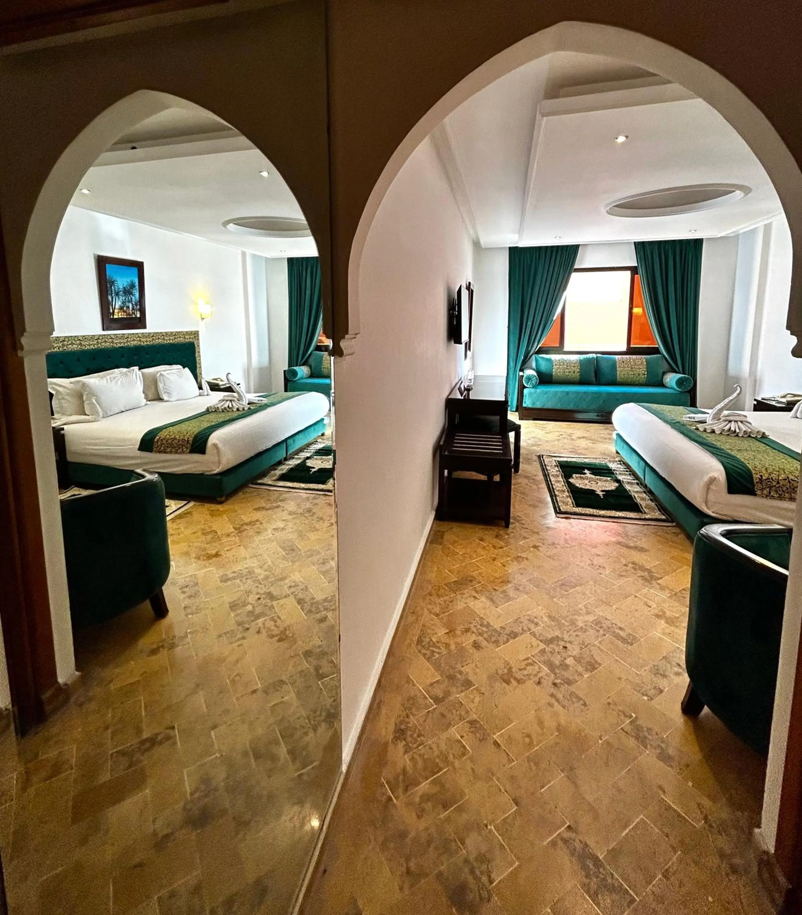 Bedroom in Hotel Les Trois Palmiers