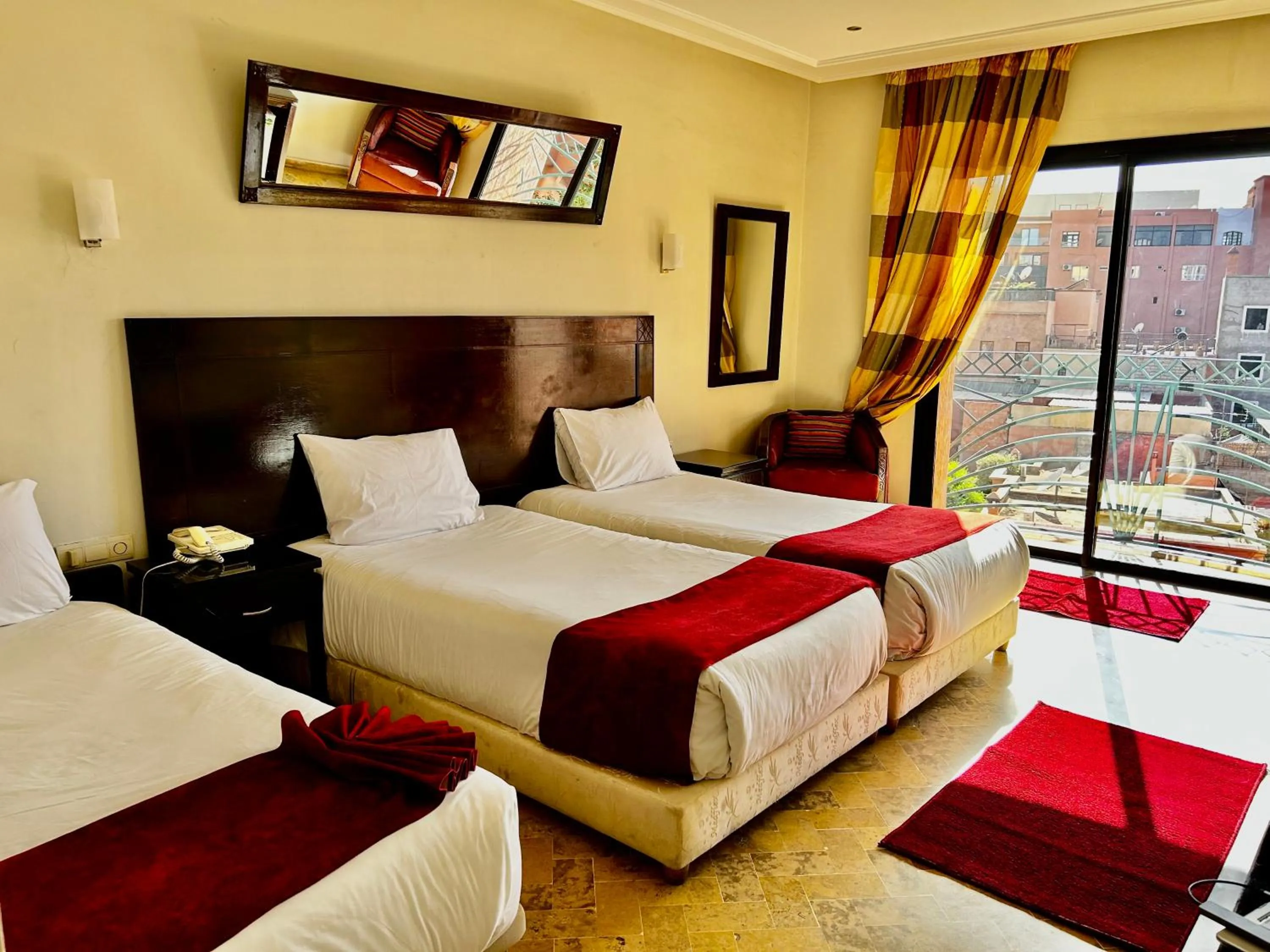 Bed in Hotel Les Trois Palmiers