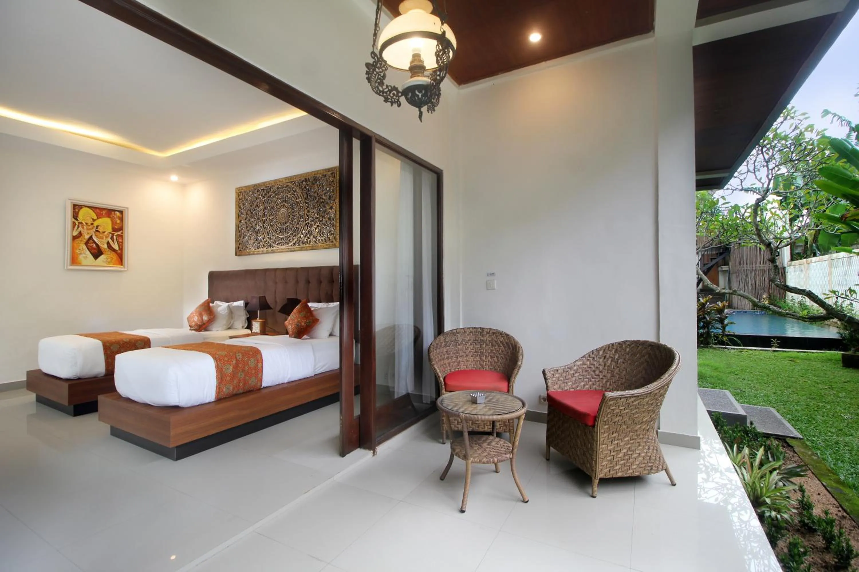 Bed in Putri Ayu Cottages