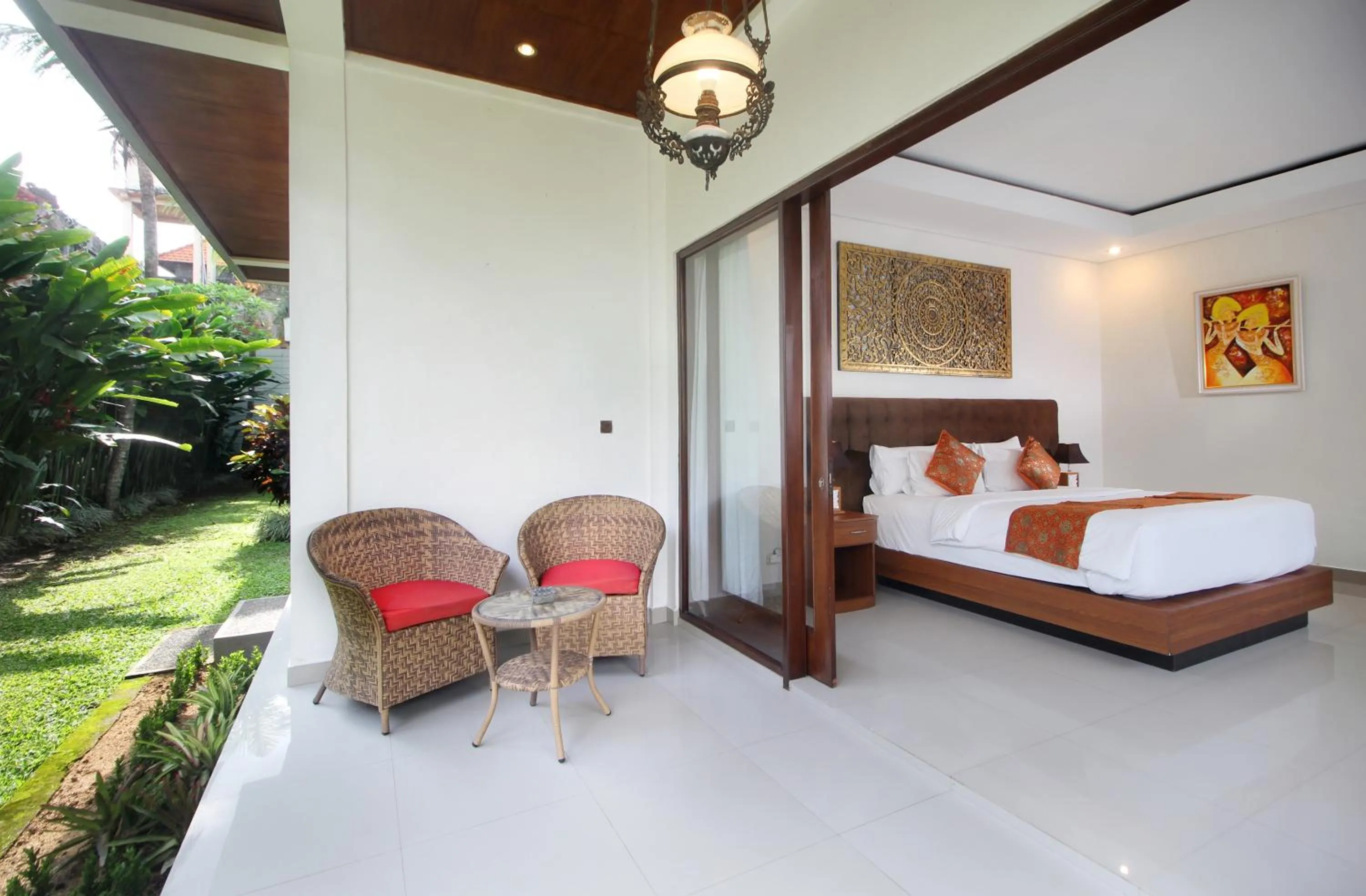 Bed in Putri Ayu Cottages