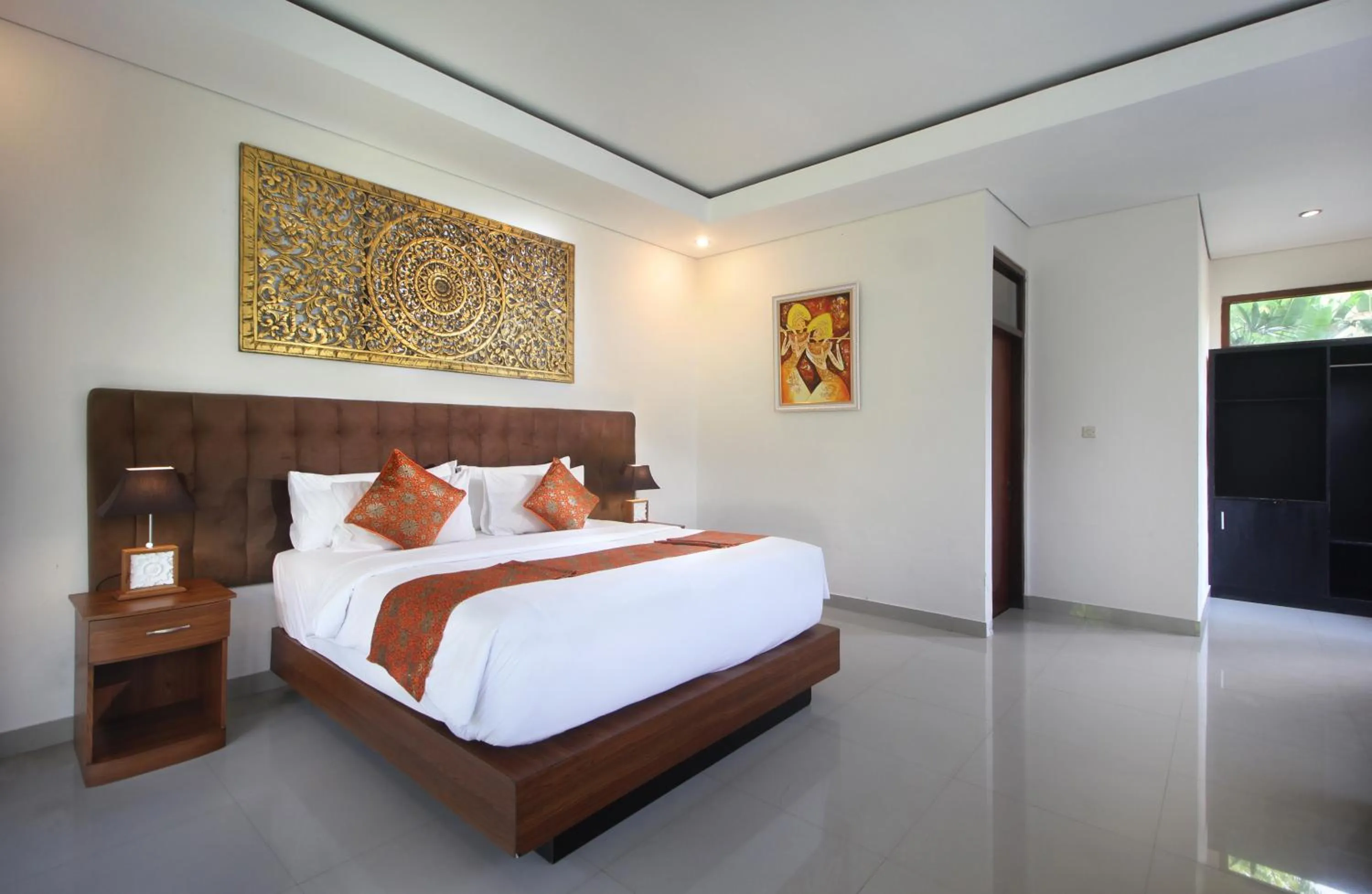 Bed in Putri Ayu Cottages