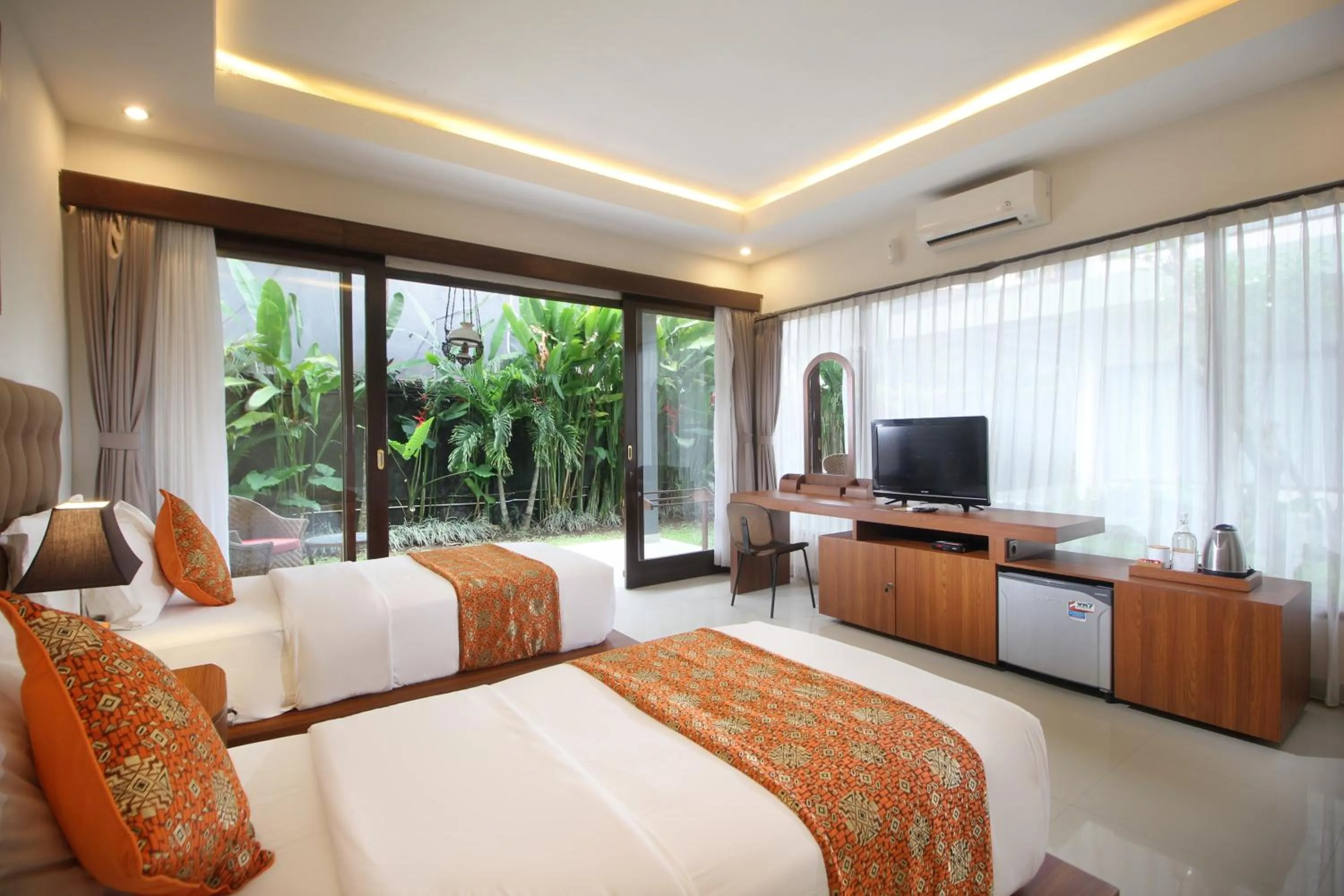 Bed in Putri Ayu Cottages