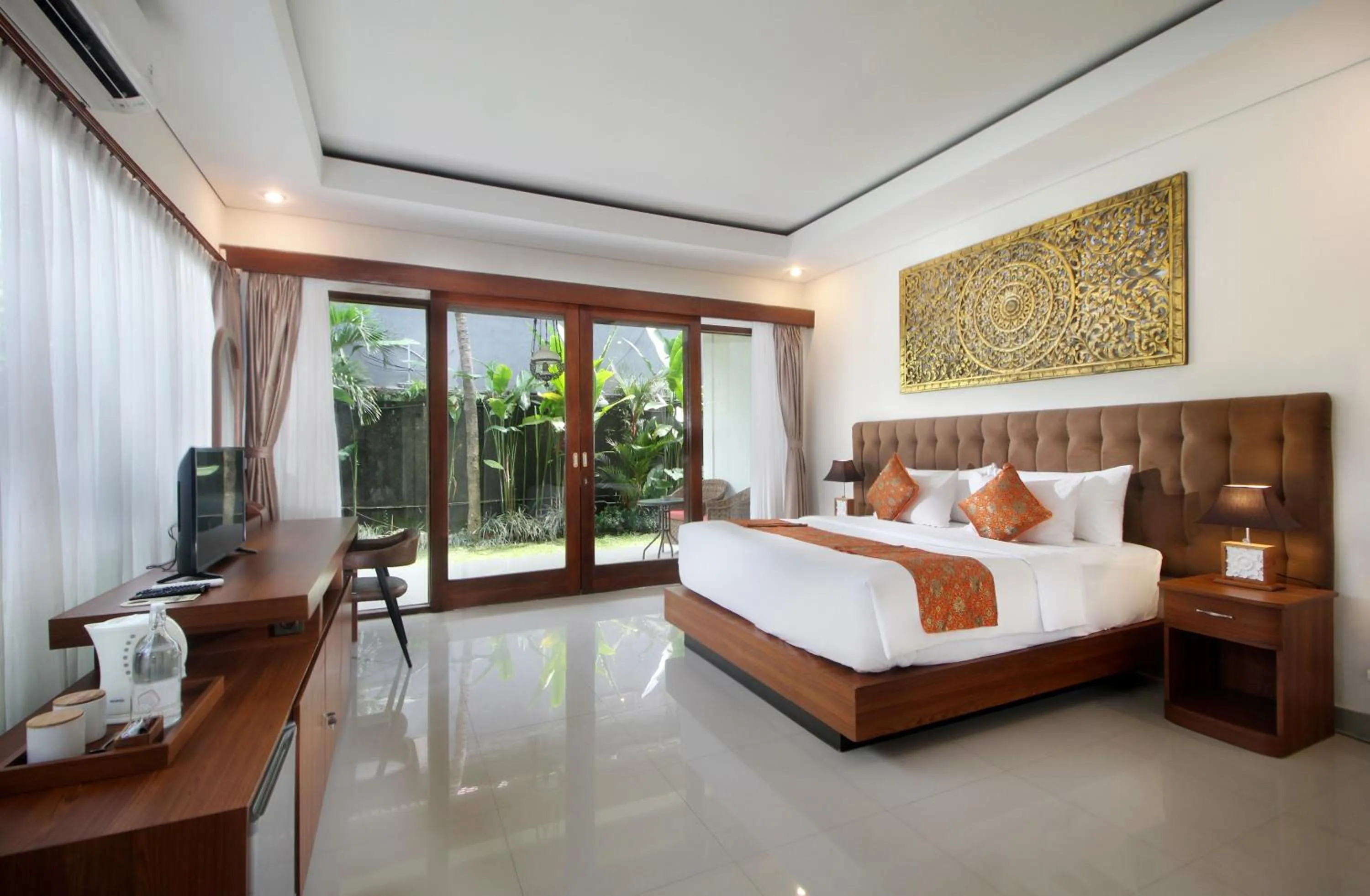 Bed in Putri Ayu Cottages