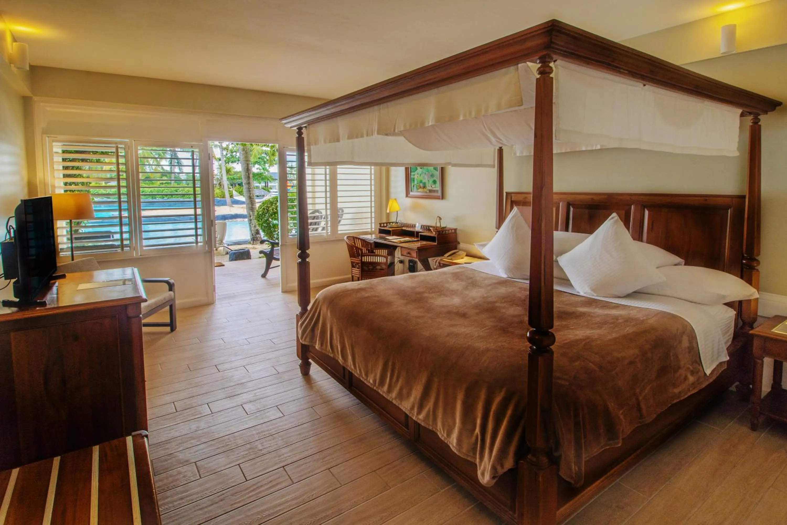 Ground-Floor Beachside Room (with breakfast for 2 Adults and Children Below 18) in Plantation Bay a Real Resort with a Real Spa
