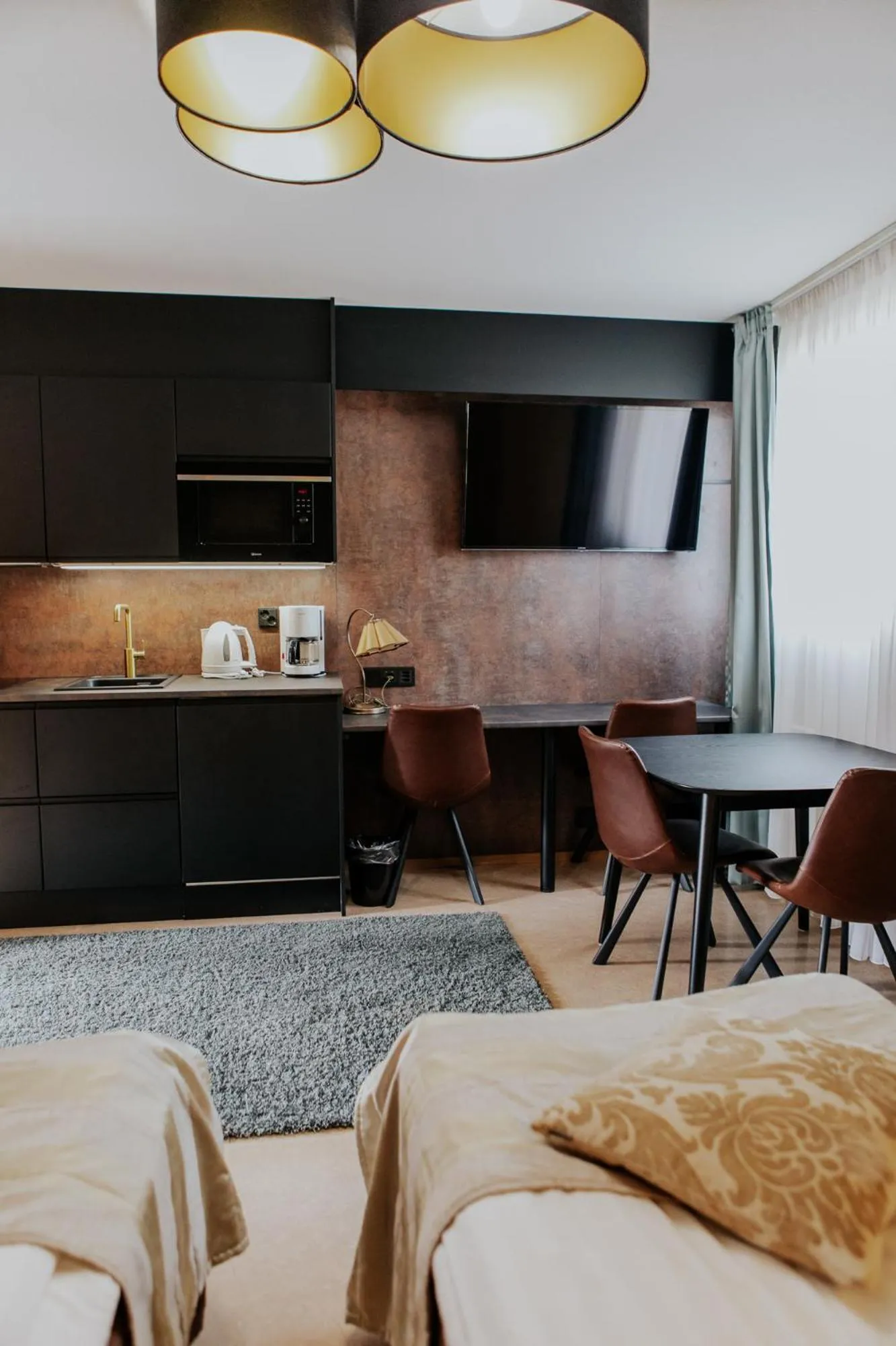 Kitchen or kitchenette, Bed in Hotel Fjalar