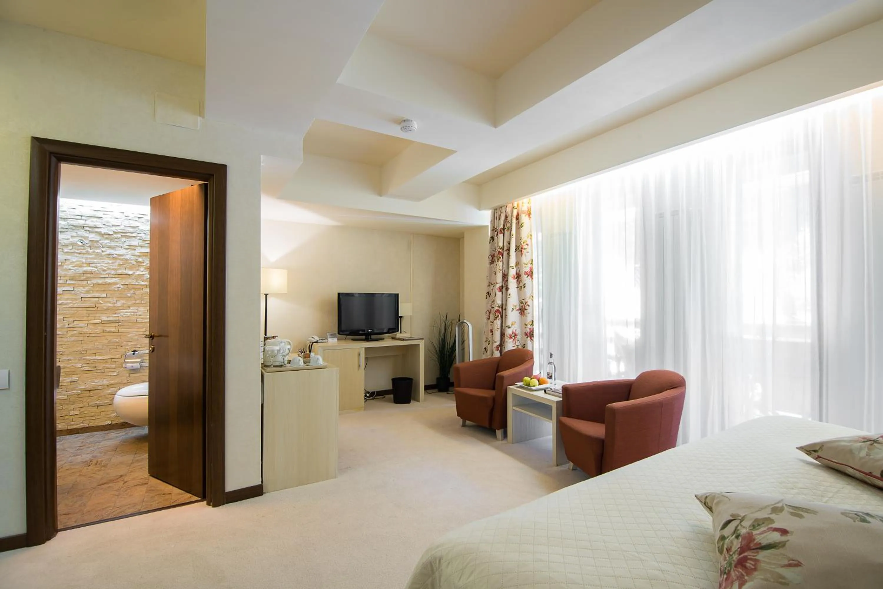 Bed in Ioana Boutique Hotel