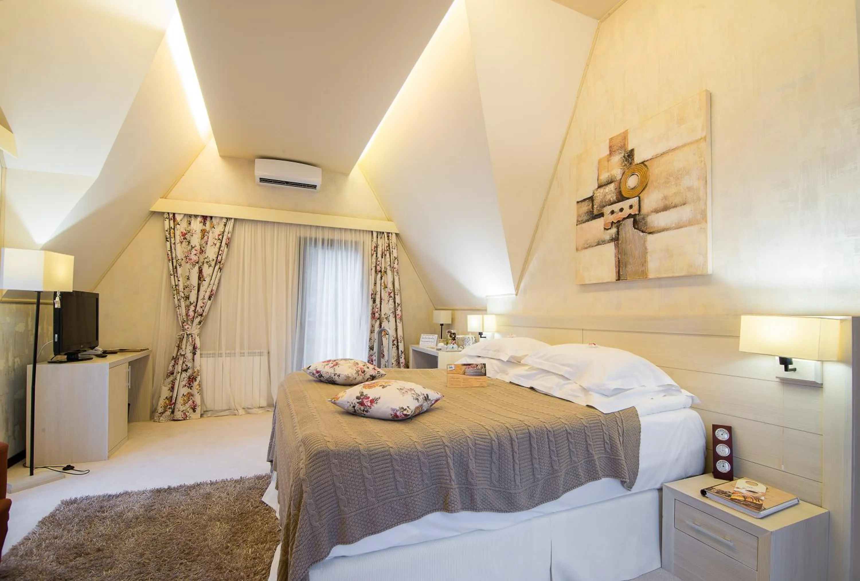 Bed in Ioana Boutique Hotel