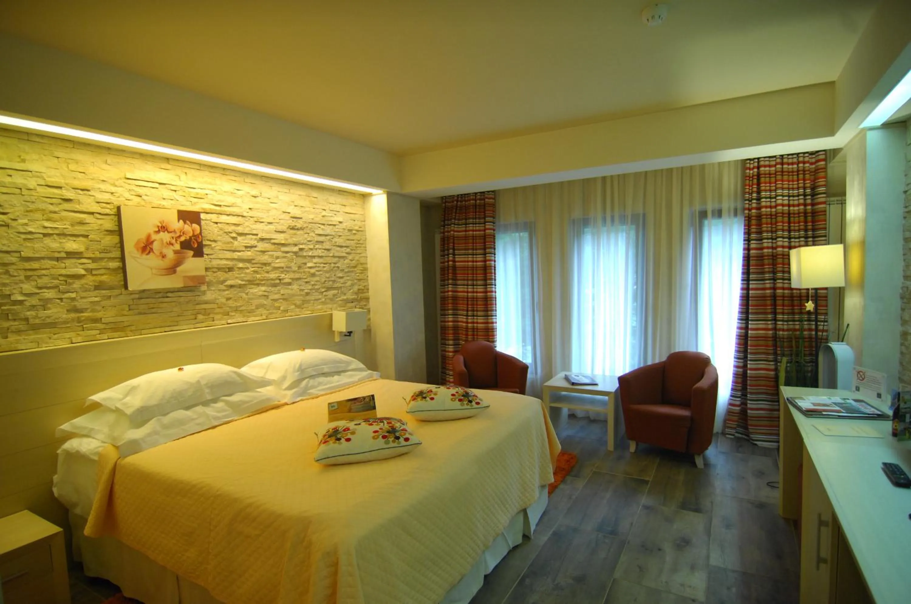 Bed in Ioana Boutique Hotel