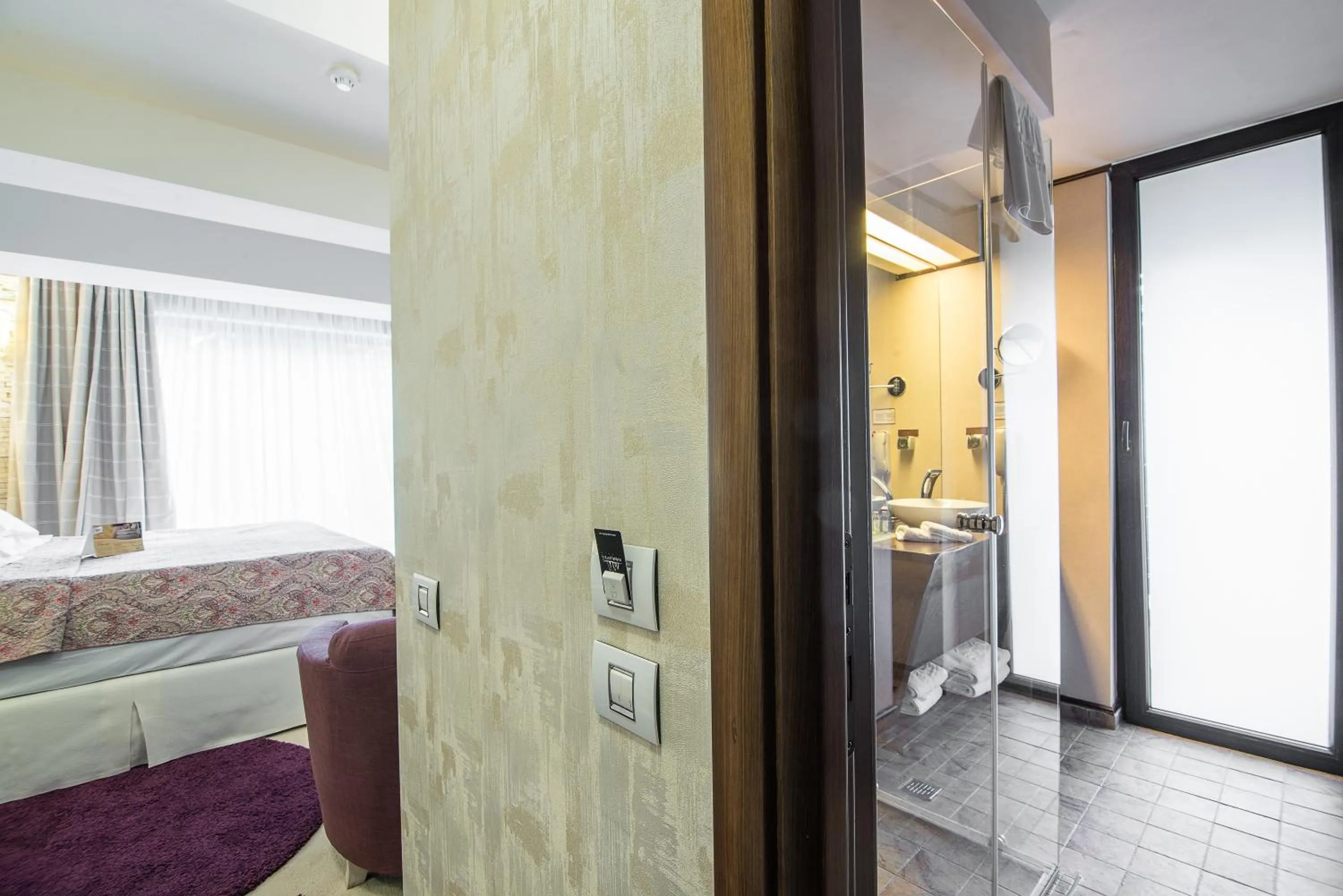 Bed in Ioana Boutique Hotel