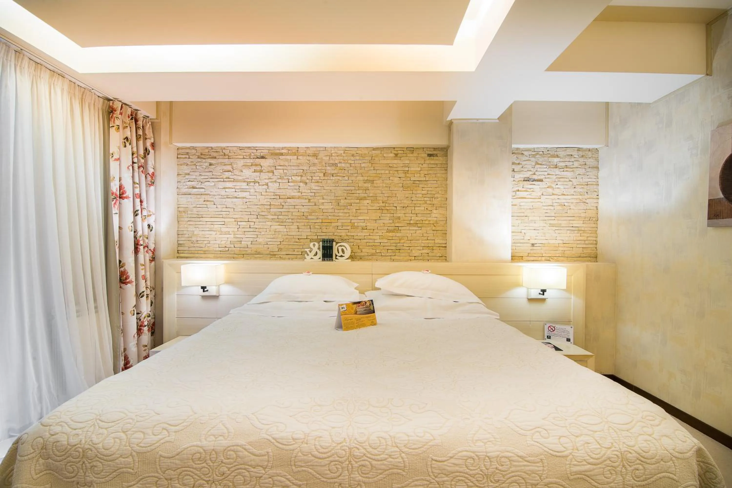 Bed in Ioana Boutique Hotel