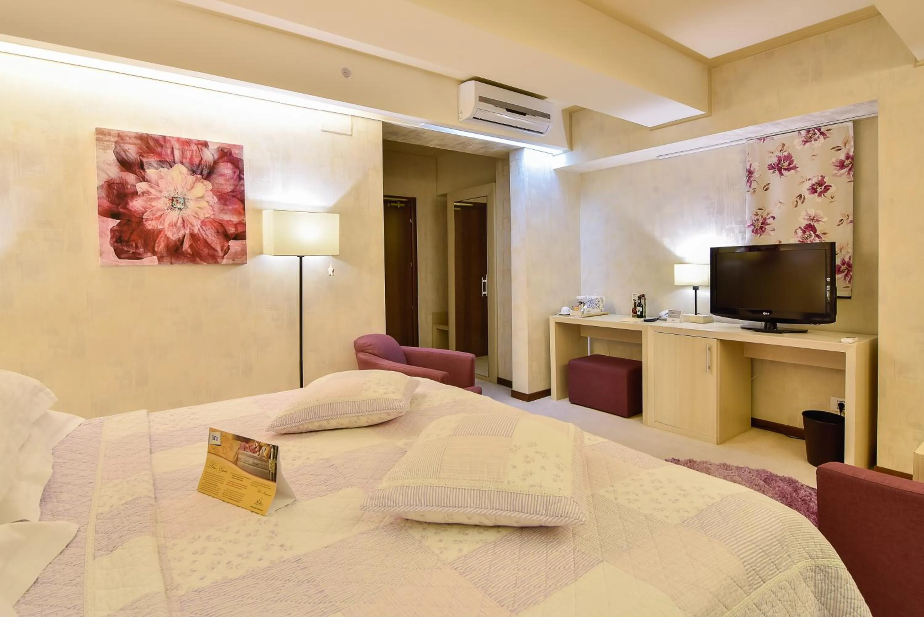 Bed in Ioana Boutique Hotel