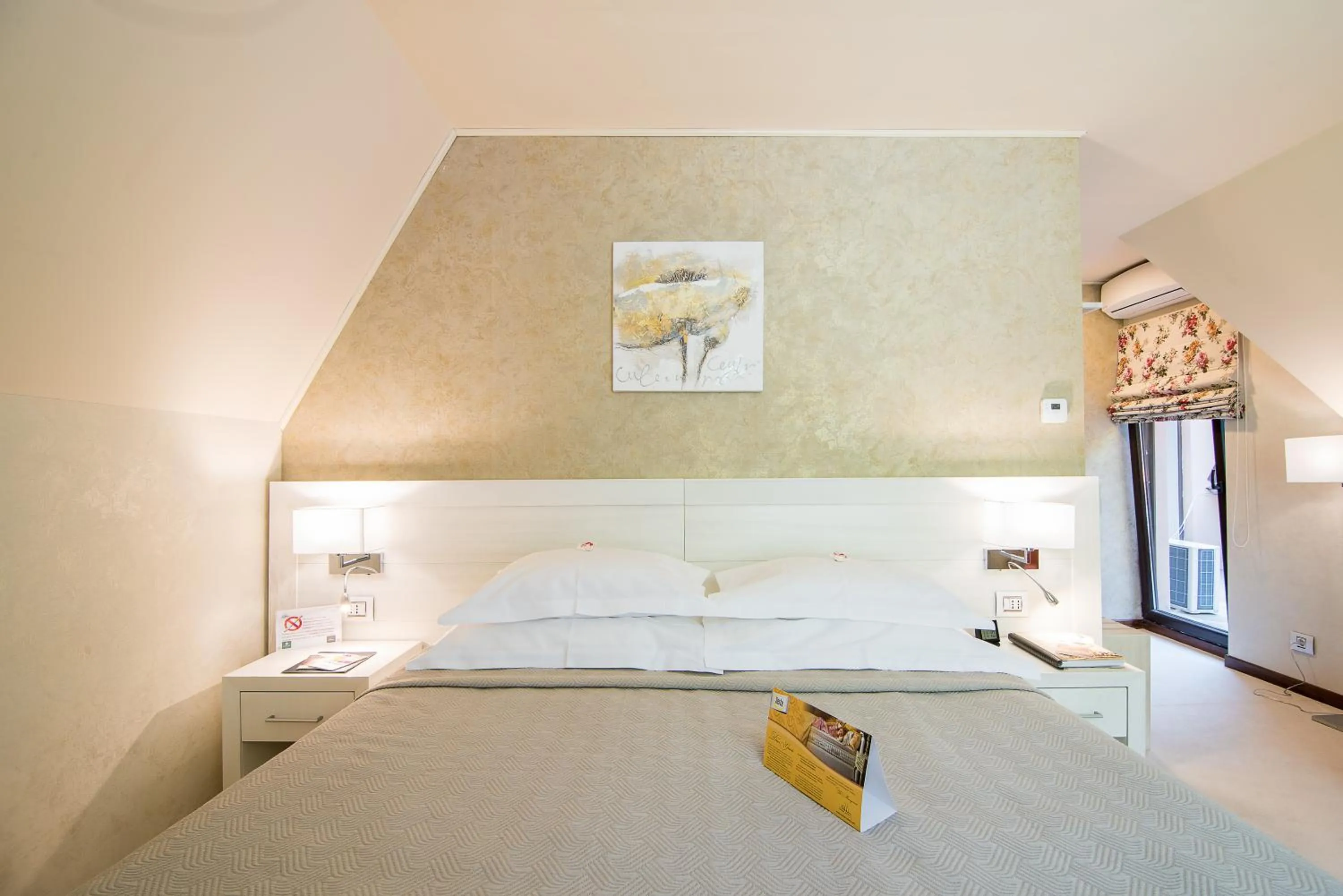 Bed in Ioana Boutique Hotel