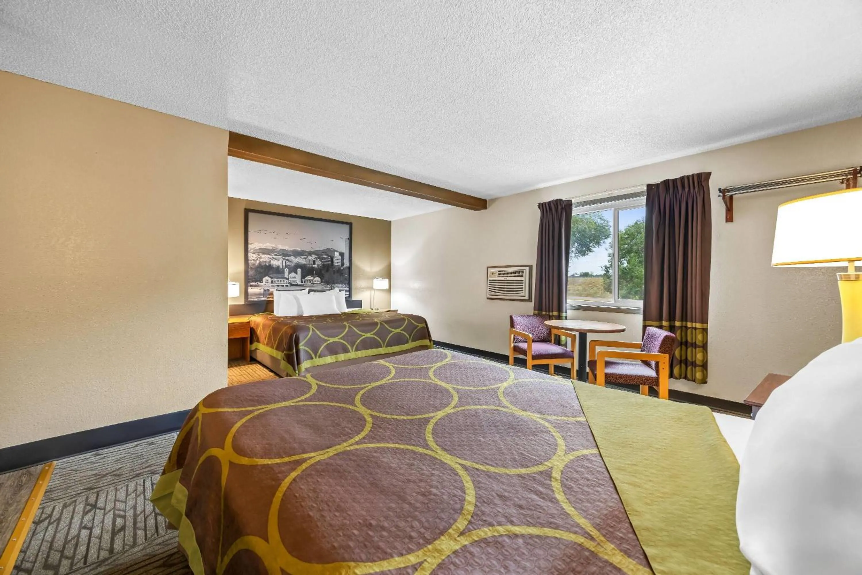 Bed in Super 8 by Wyndham Colorado Springs Peterson Space Force