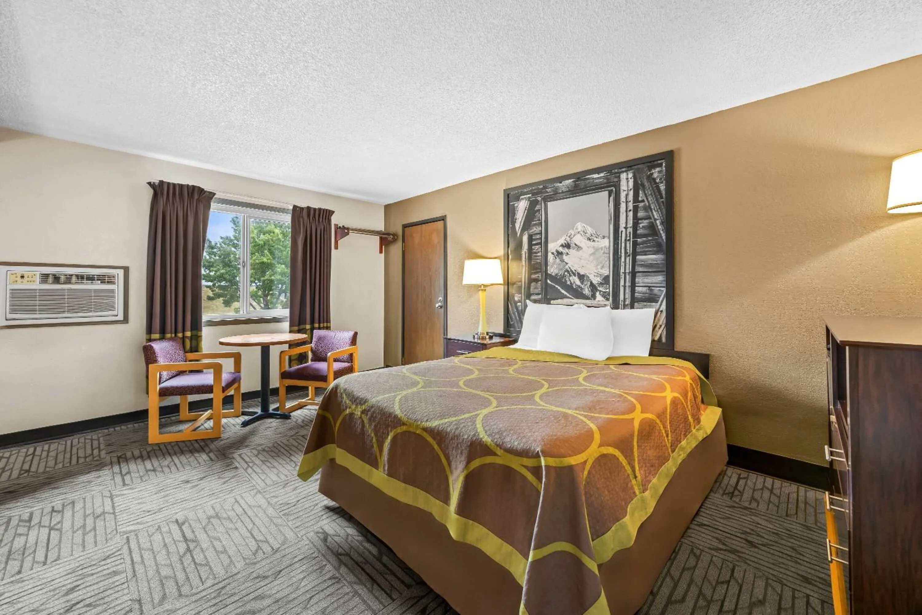 Bed in Super 8 by Wyndham Colorado Springs Peterson Space Force