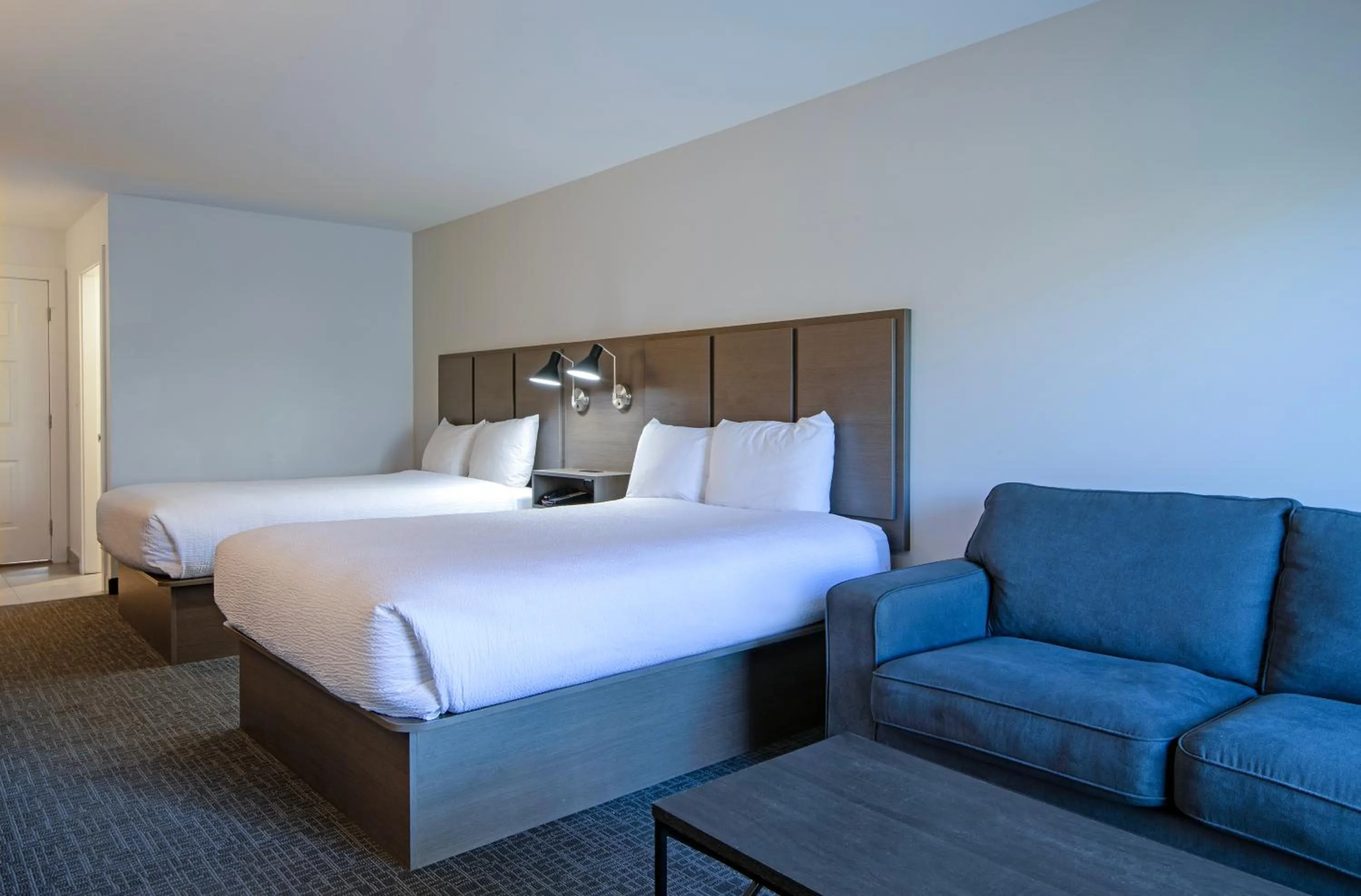 Bed in Riverland Inn & Suites