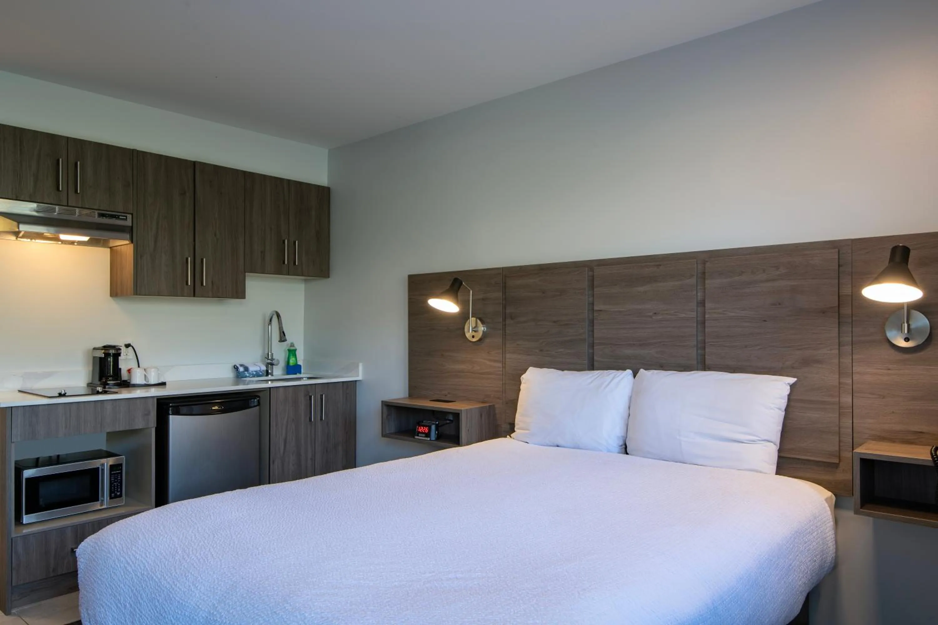 Bed in Riverland Inn & Suites