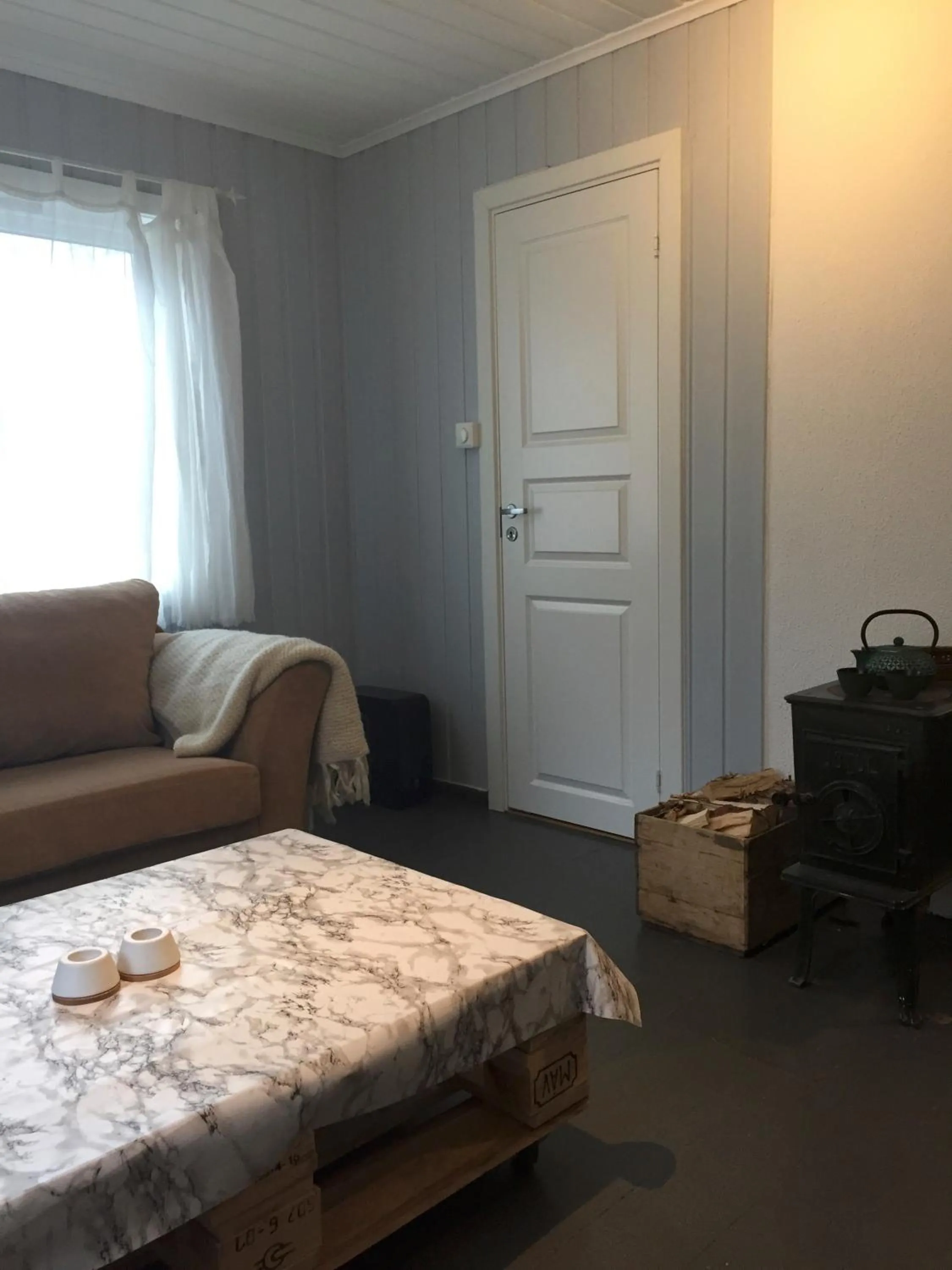 Living room in Koselig Hytte i Hemsedal with outdoor Sauna